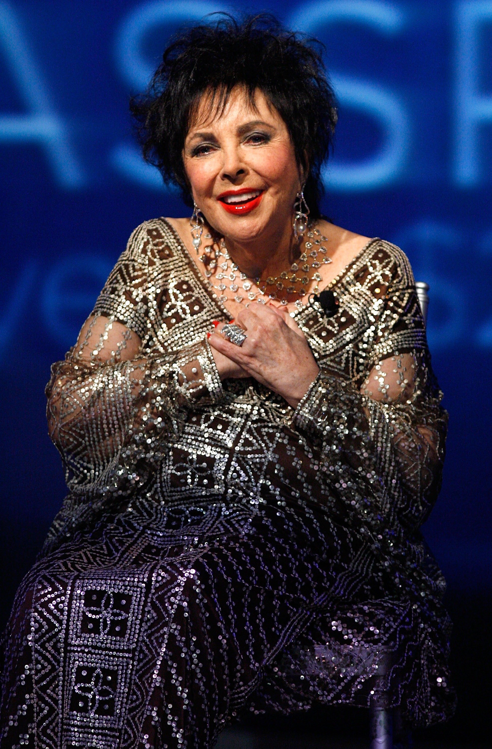 Elizabeth Taylor speaks onstage during the 25th Anniversary celebration gala for Macy's Passport at Santa Monica Airport's Barker Hangar on September 27, 2007 in Los Angeles, California. / Source: Getty Images