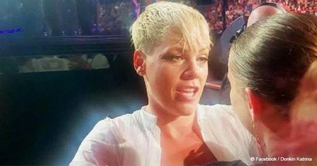 Pink stops concert, walks into crowd to hug grieving fan (video)