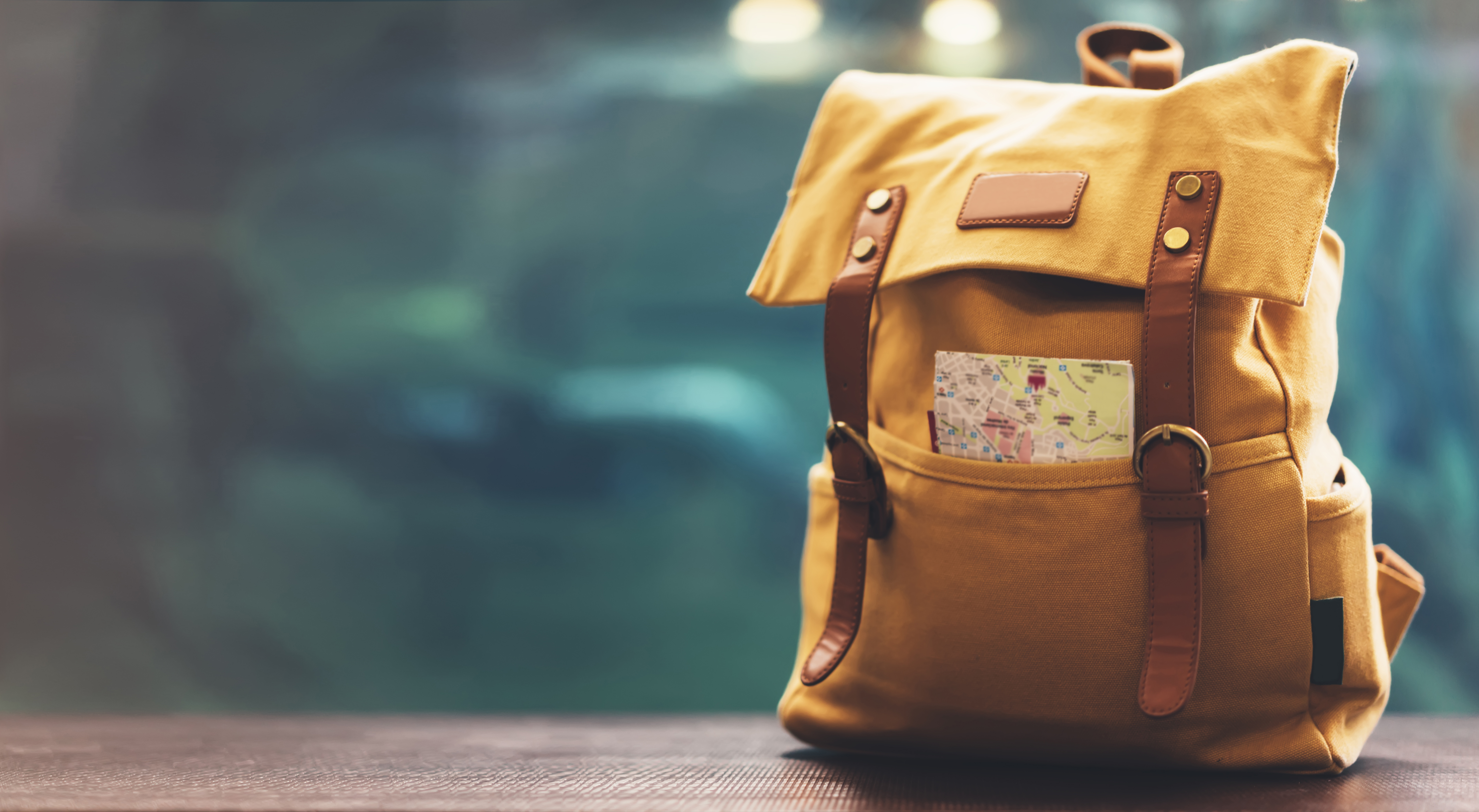 A traveler's backpack with a map | Source: Shutterstock