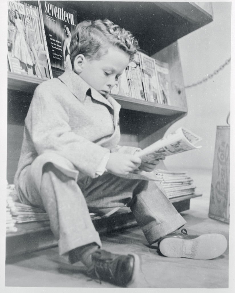 A portrait of Rusty Hamer reading the papers on January 01, 1955 | Photo: Getty Images