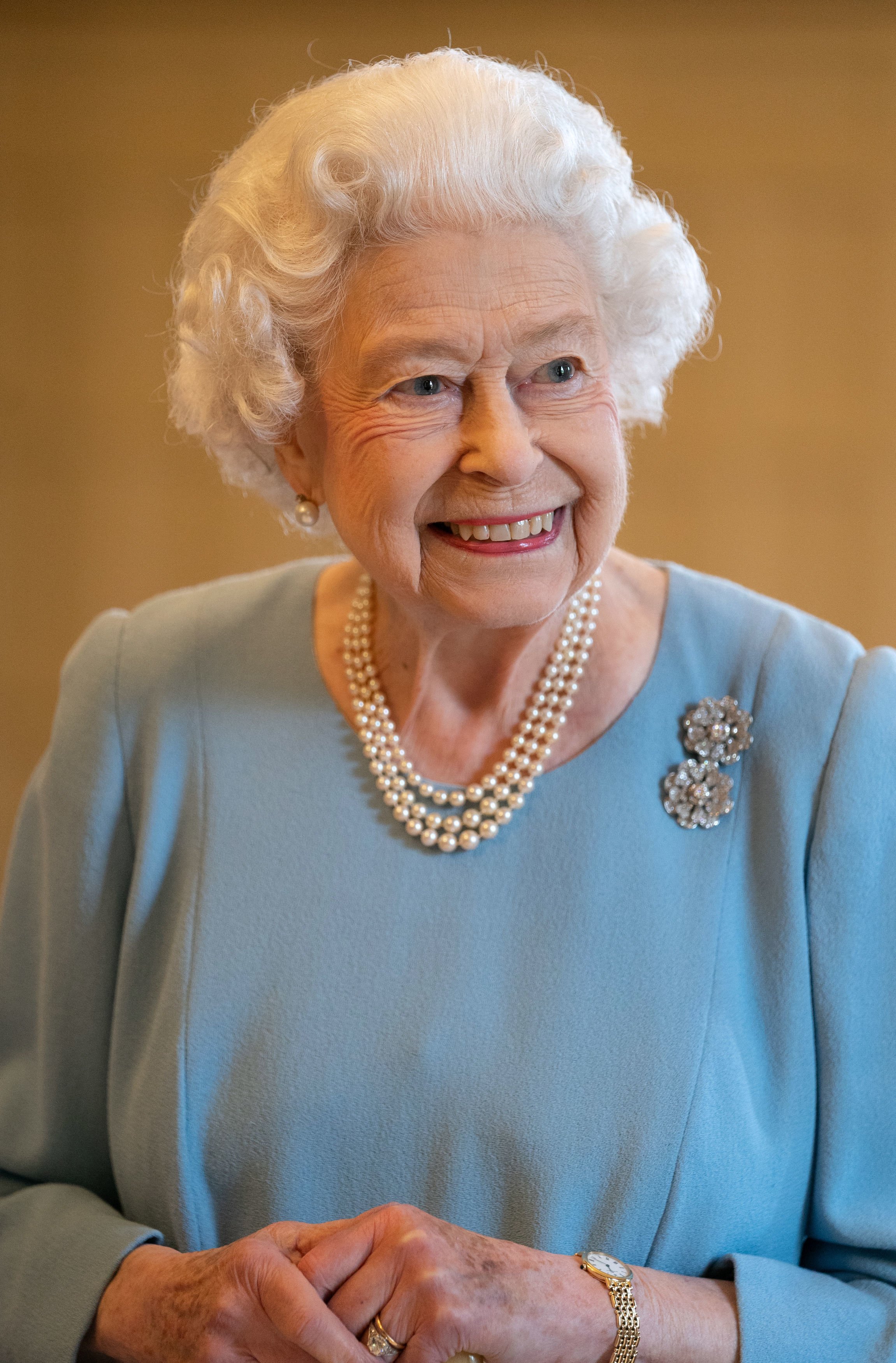 Queen Elizabeth II pictured beaming during a reception in the Ballroom of Sandringham House on February 5, 2022 in King's Lynn, England | Source: Getty Images