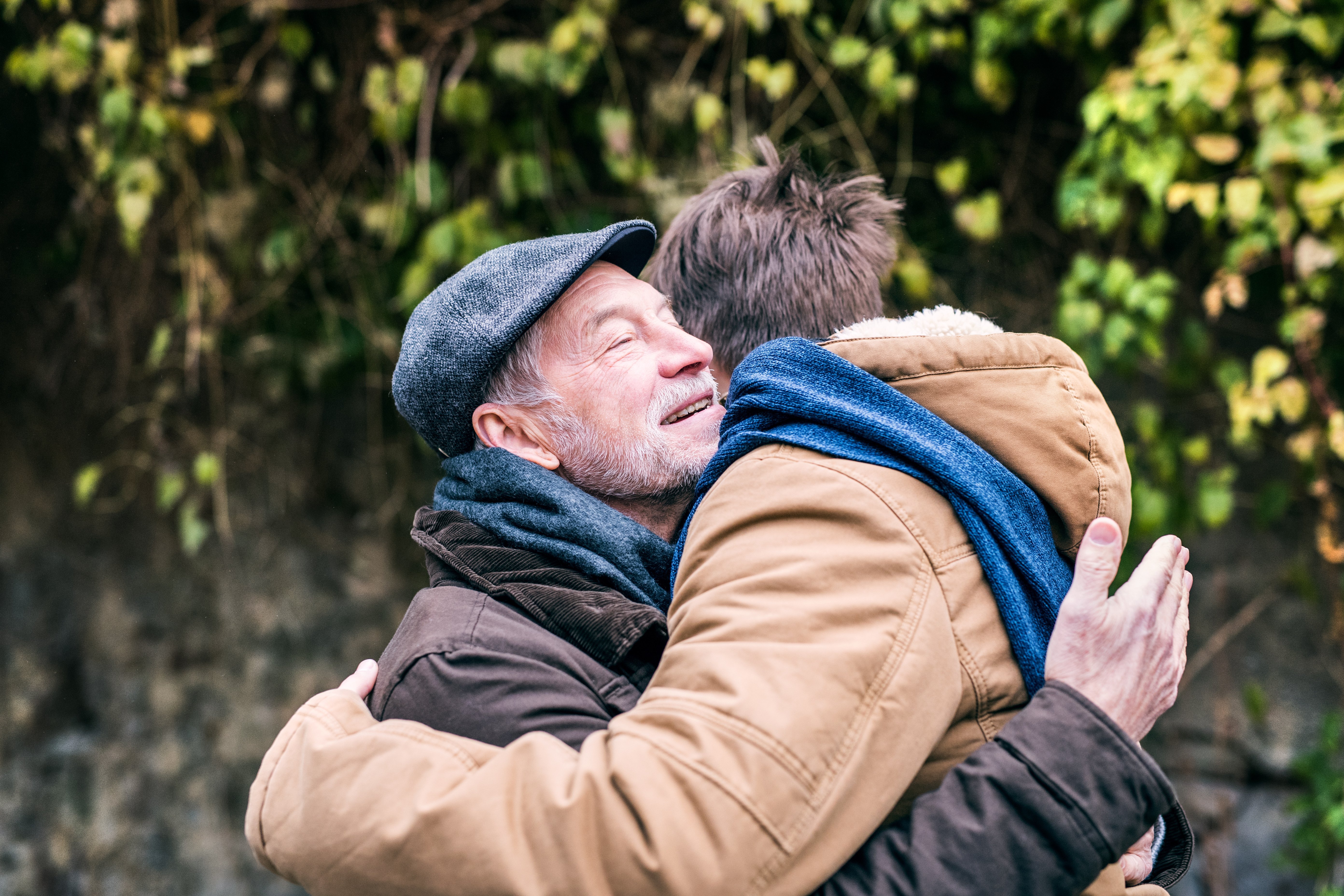 An older man hugging another man | Photo: Shutterstock
