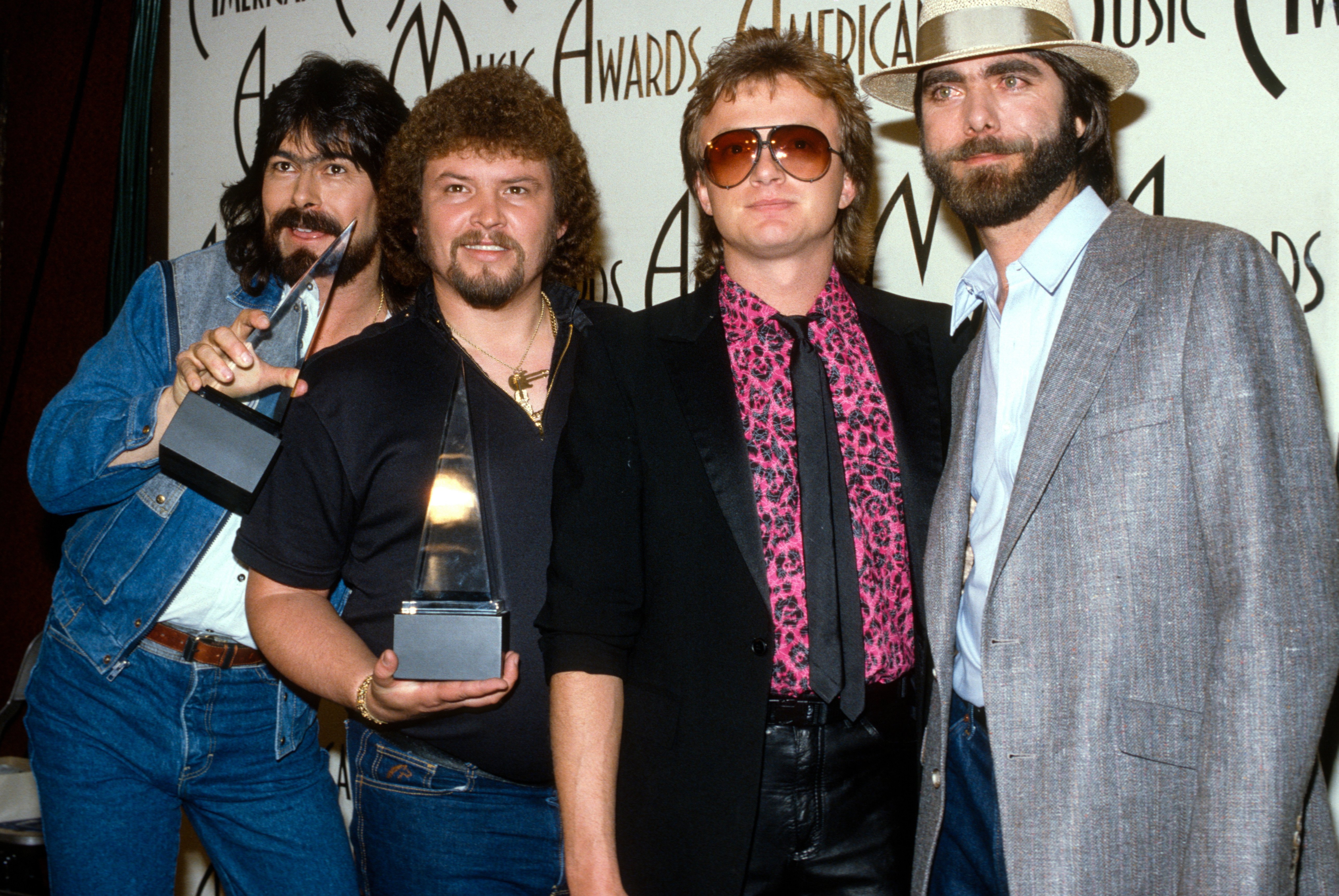 Randy Owen, Jeff Cook, Mark Herndon, and Teddy Gentry of Alabama at the American Music Awards circa 1985 | Source: Getty Images