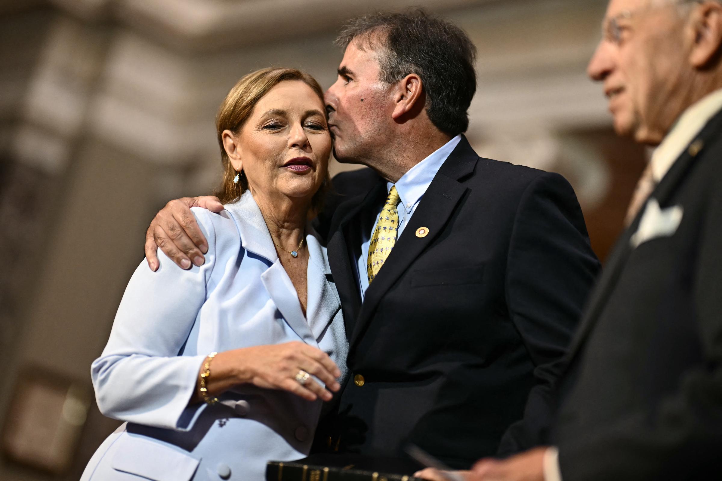 In a tender moment amid a tumultuous week, Darline Graham Nordone receives a loving embrace from her husband, Larry, following her swearing-in ceremony at the U.S. Capitol on July 14, 2026. | Source: Getty Images