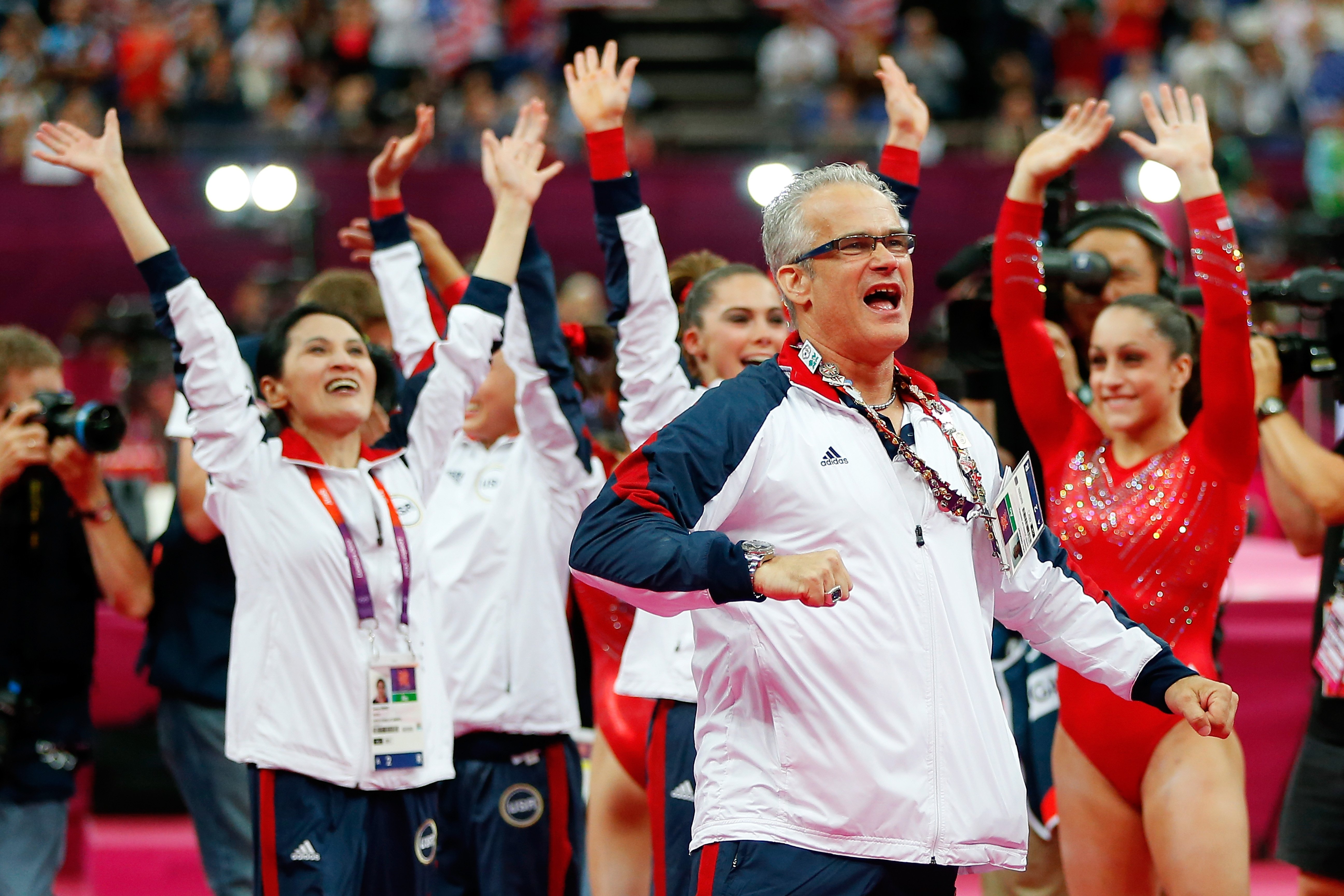 United States women's gymnastics coach John Geddert celebrating during the final rotation in the Artistic Gymnastics Women's Team final at the London 2012 Olympic Games at North Greenwich Arena in London, England | Photo: Jamie Squire/Getty Images