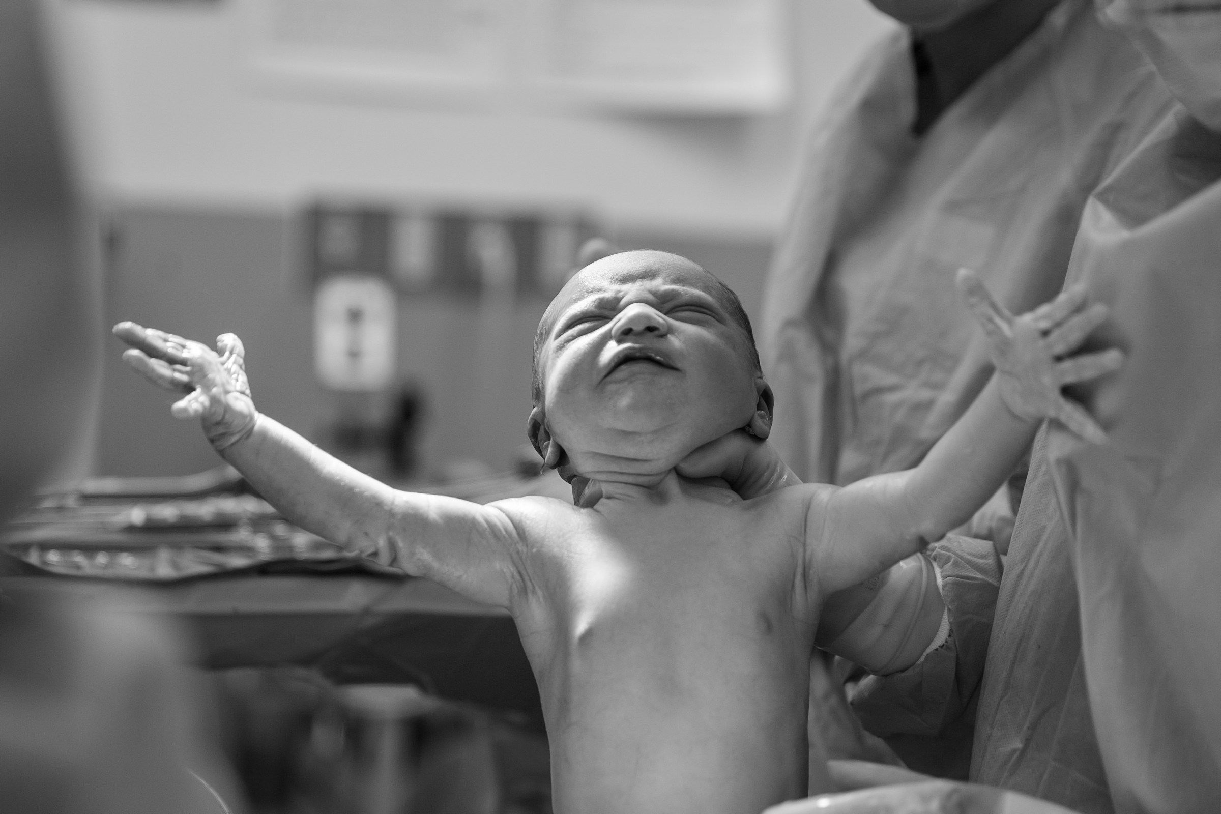 A grayscale photo of a newborn baby | Source: Unsplash