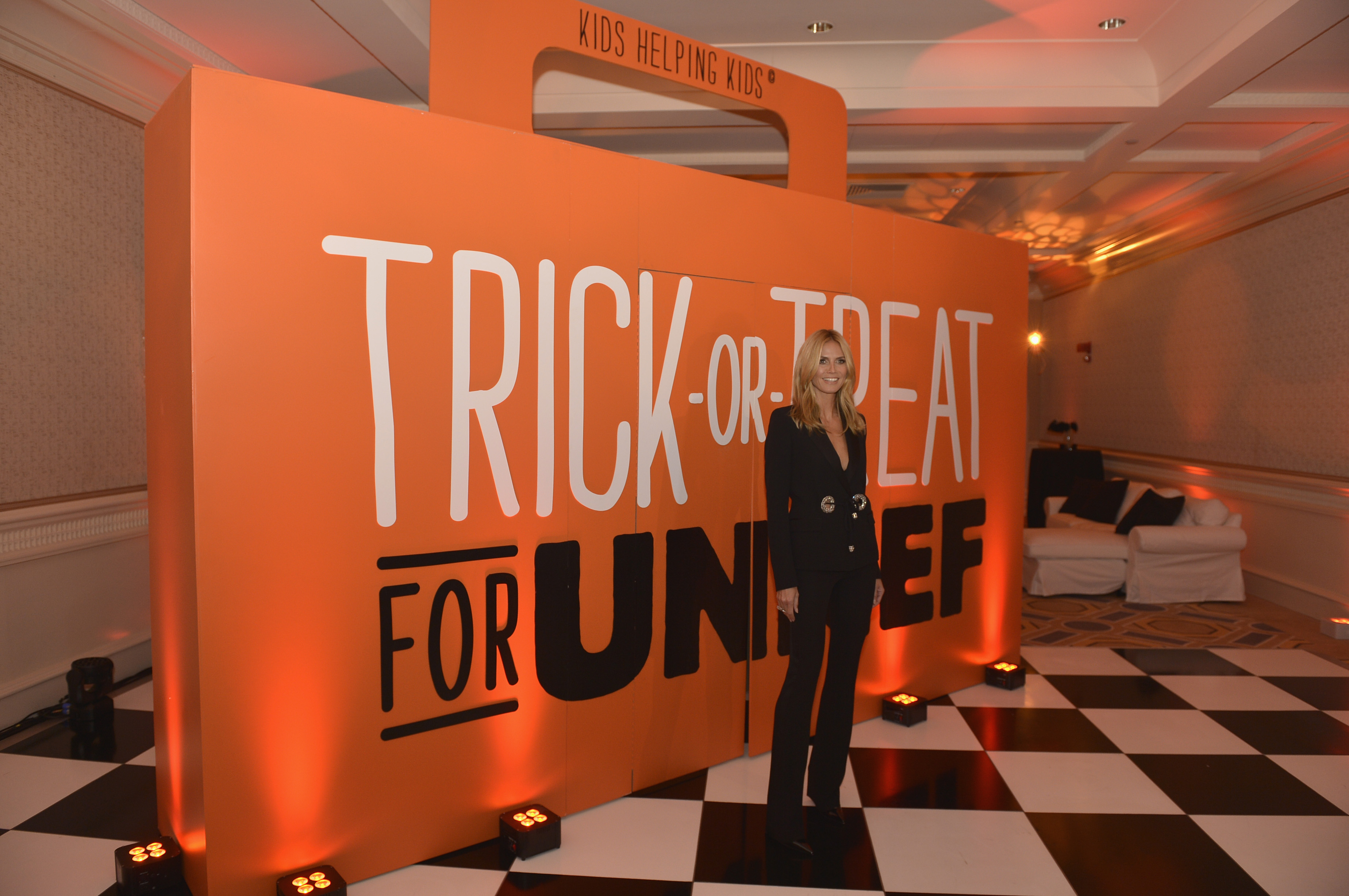 Heidi Klum stands beside a Trick-or-Treat for UNICEF display, highlighting a long-running commitment to the organization that eventually led to her appointment as its newest ambassador. | Source: Getty Images