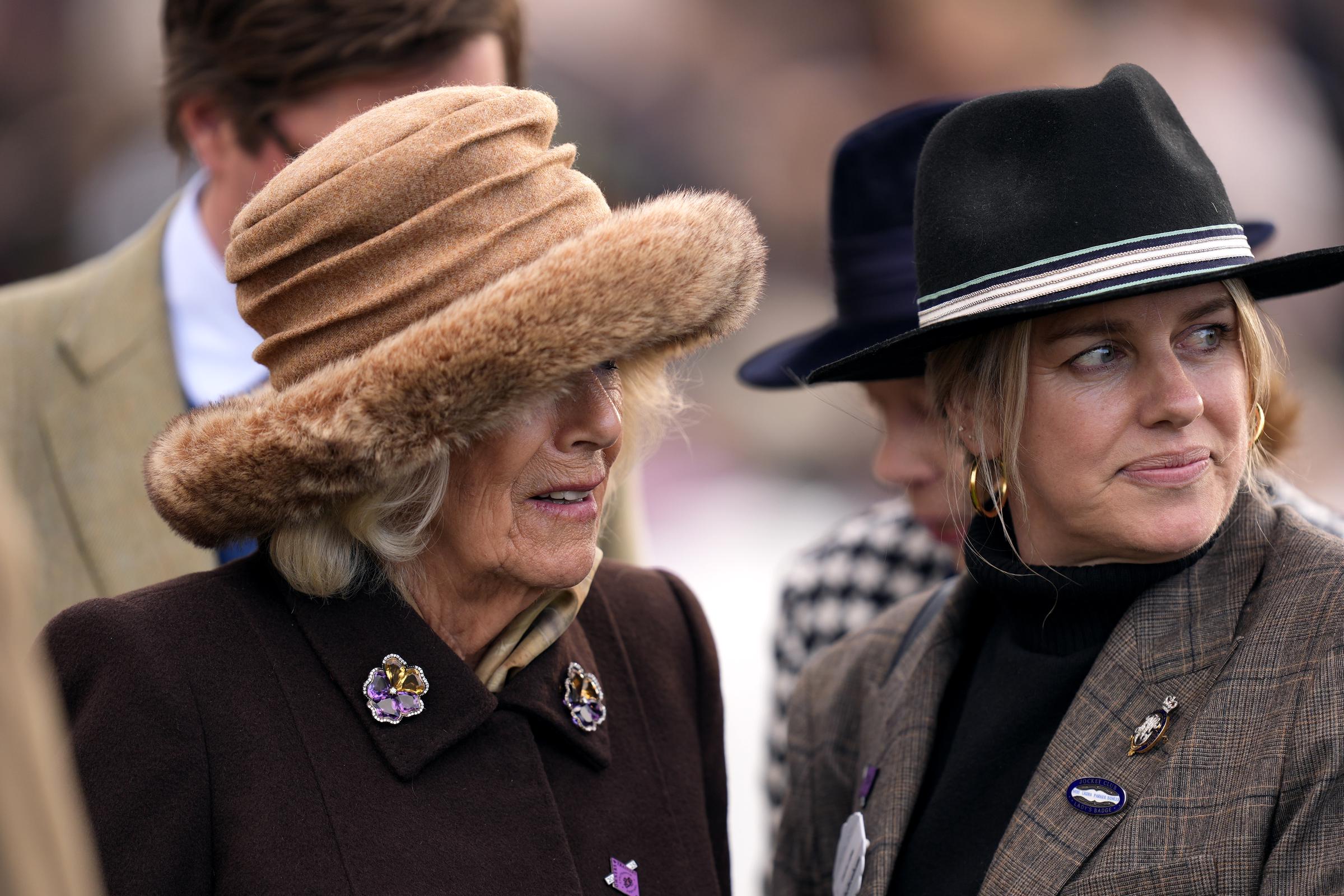 Queen Camilla with daughter Laura Lopes in the parade ring on day two of the 2025 Cheltenham Festival at Cheltenham Racecourse, on March 12, 2025 | Source: Getty Images