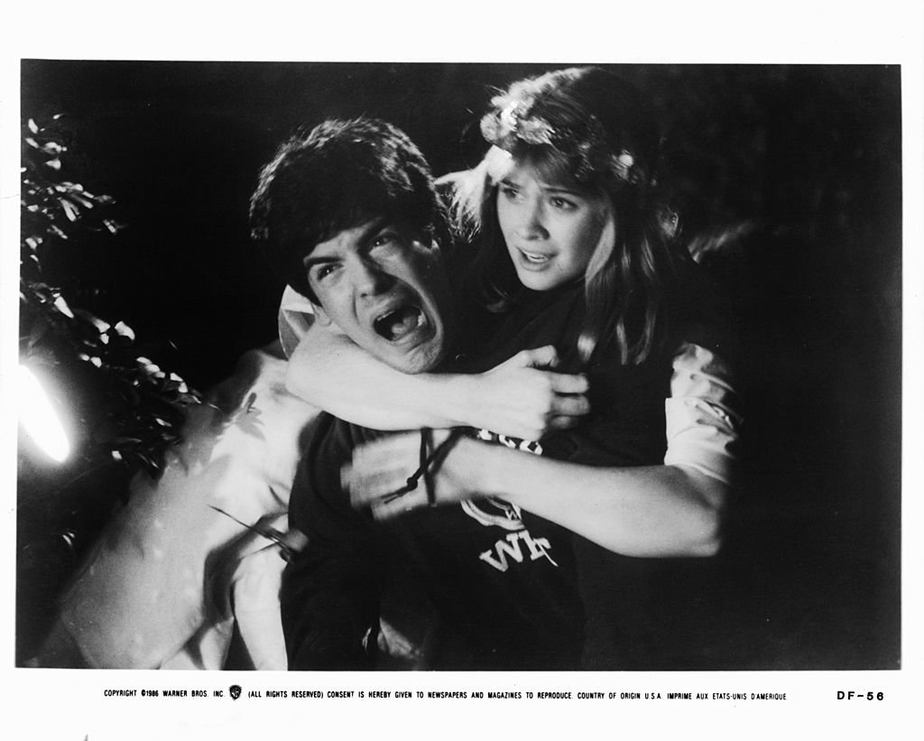 Matthew Labyorteaux is clutched by Kristy Swanson in a scene from the film "Deadly Friend," circa 1986. | Photo: Getty Images