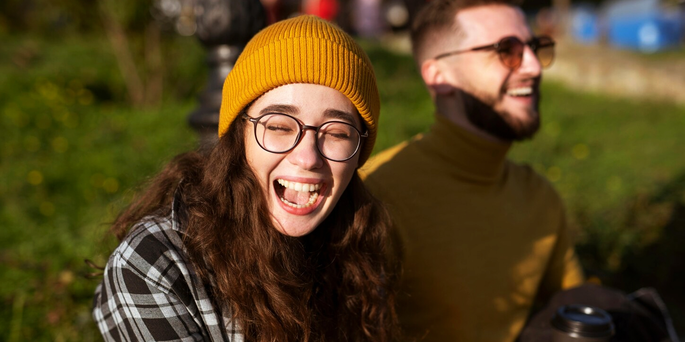 A close up of a laughing young woman | Source: Freepik