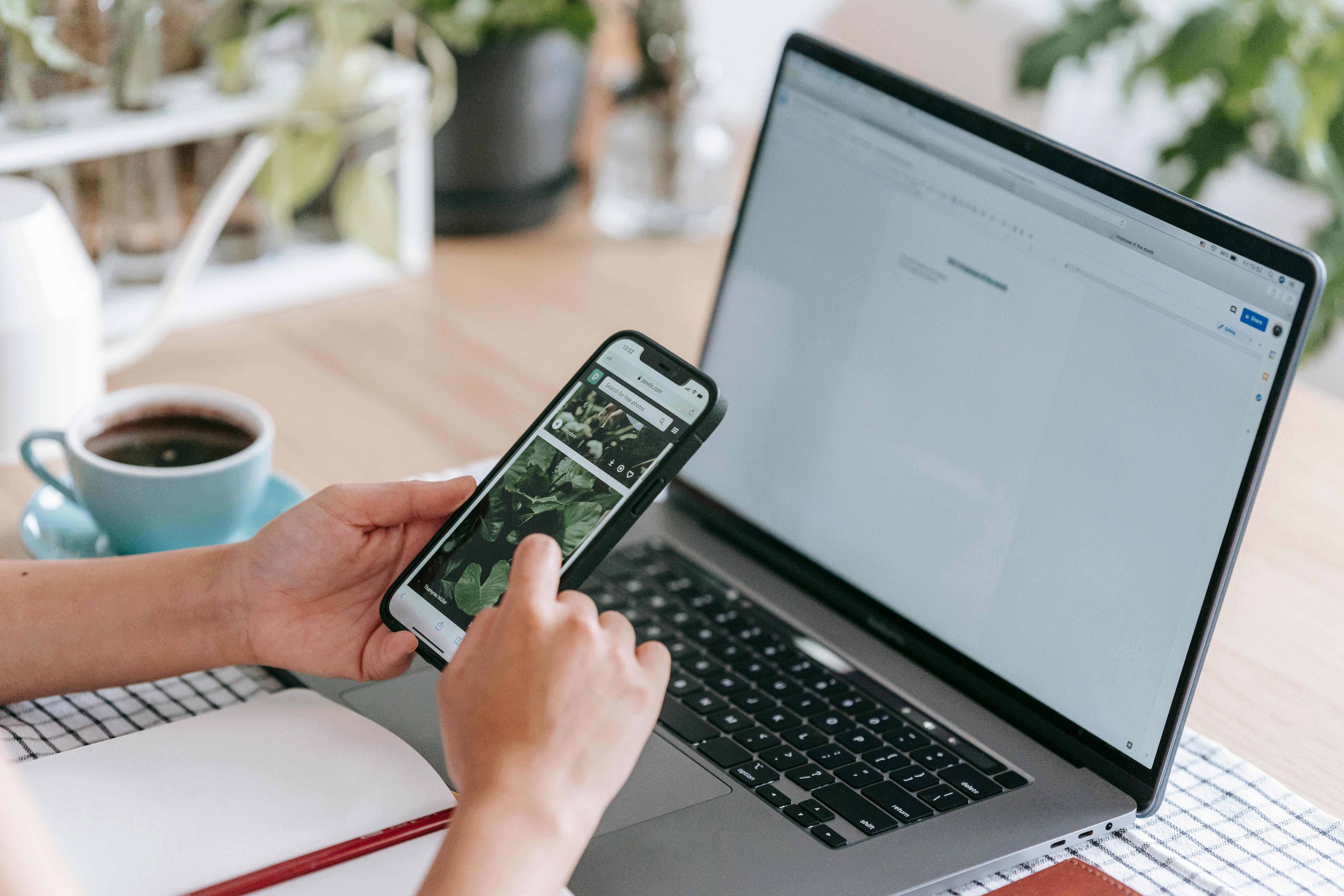 A woman looking at the photos on her phone | Source: Pexels