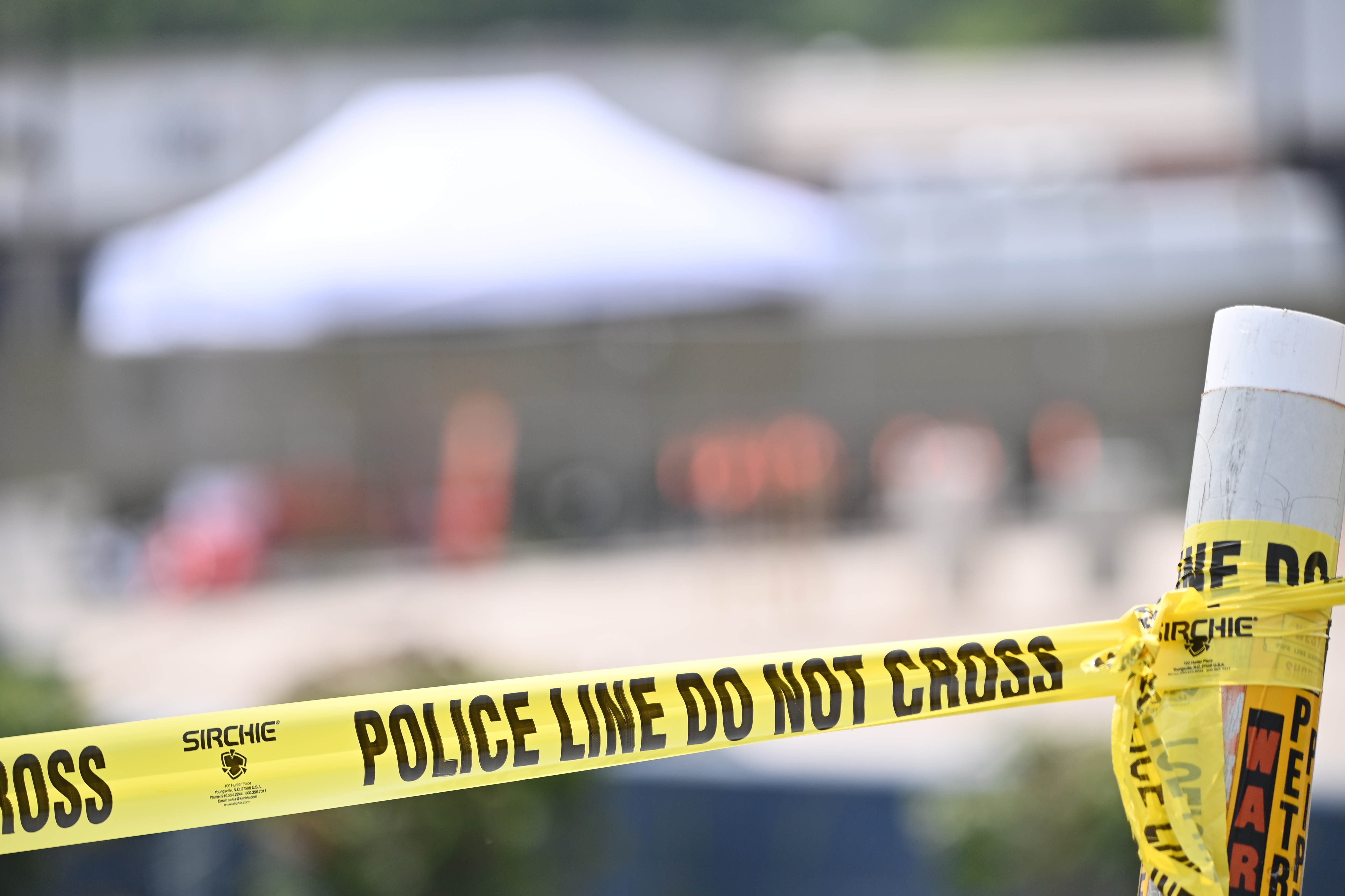 Police cordon off the area where at least one person was killed and 22 others wounded in a shooting in a strip mall parking lot in Willowbrook, Illinois, on June 18, 2023 | Source: Getty Images