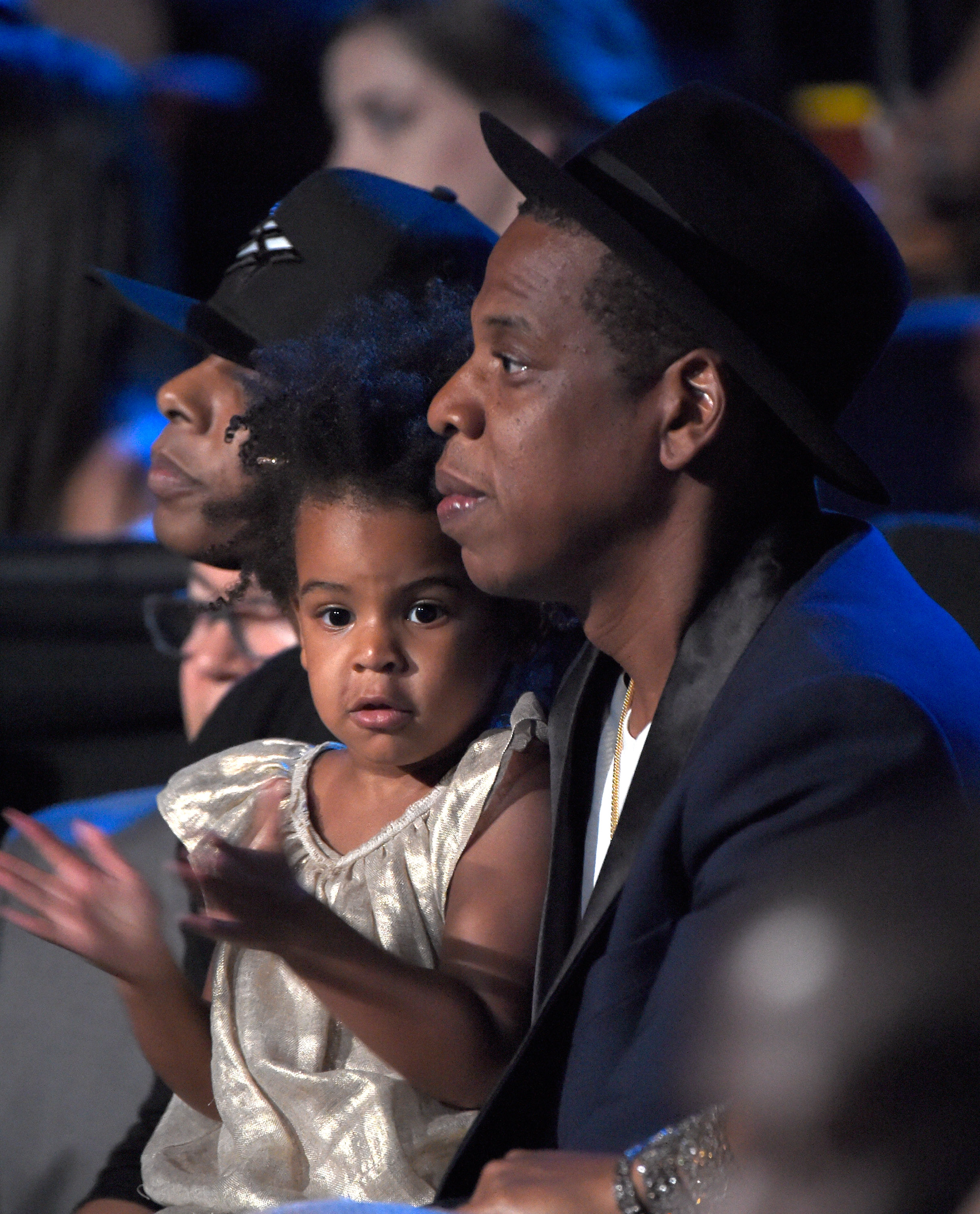 Blue Ivy Carter, 2, wore a shiny gold dress while in the audience with her father, Jay-Z, during the MTV Video Music Awards at The Forum on August 24, 2014, in Inglewood, California. Her hair was styled in natural, coily afro puffs.