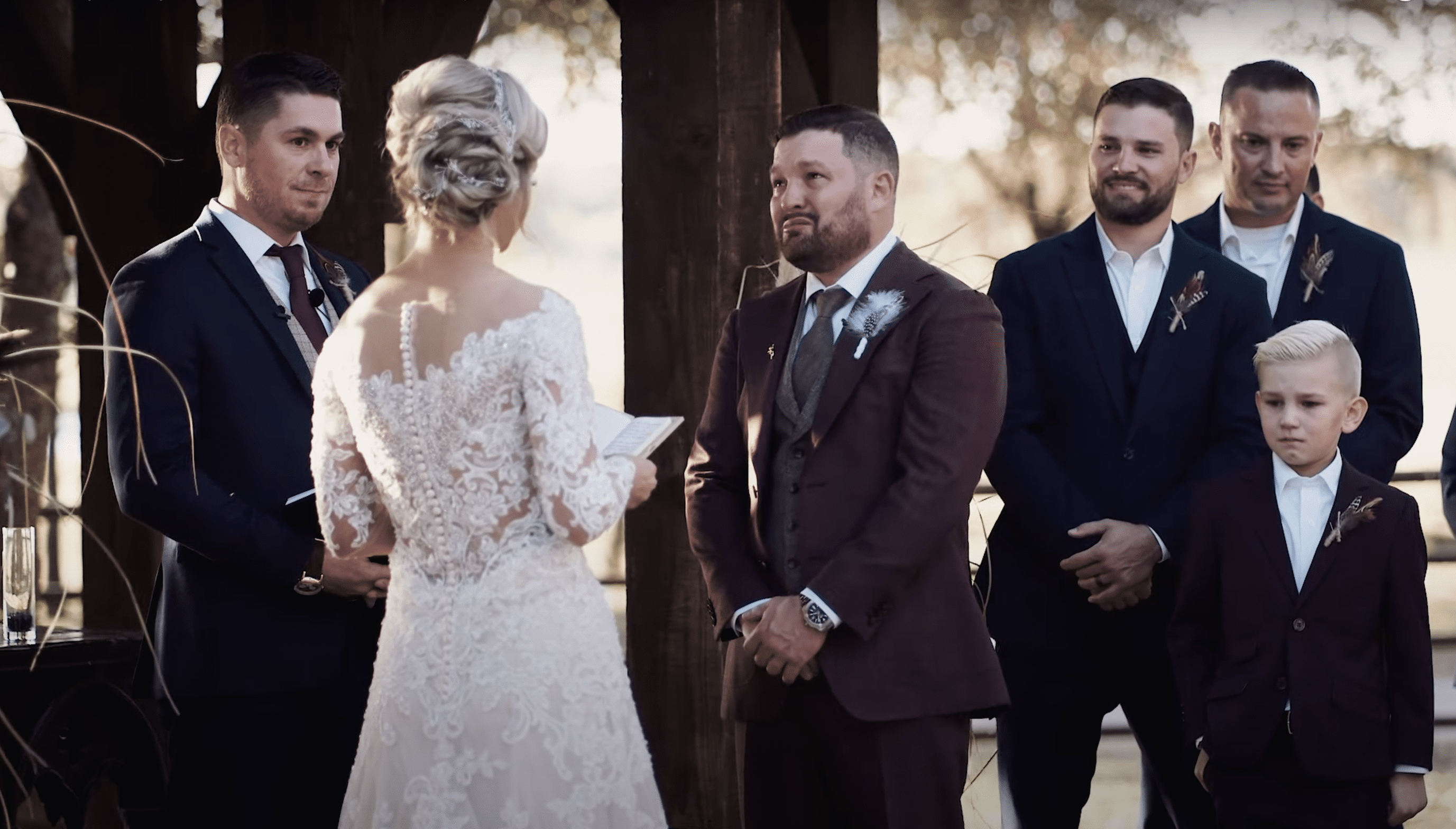 Bryan filled with emotions as his wife, Whitney read out her vows to him. | Source: Youtube.com/BSR Weddings Films