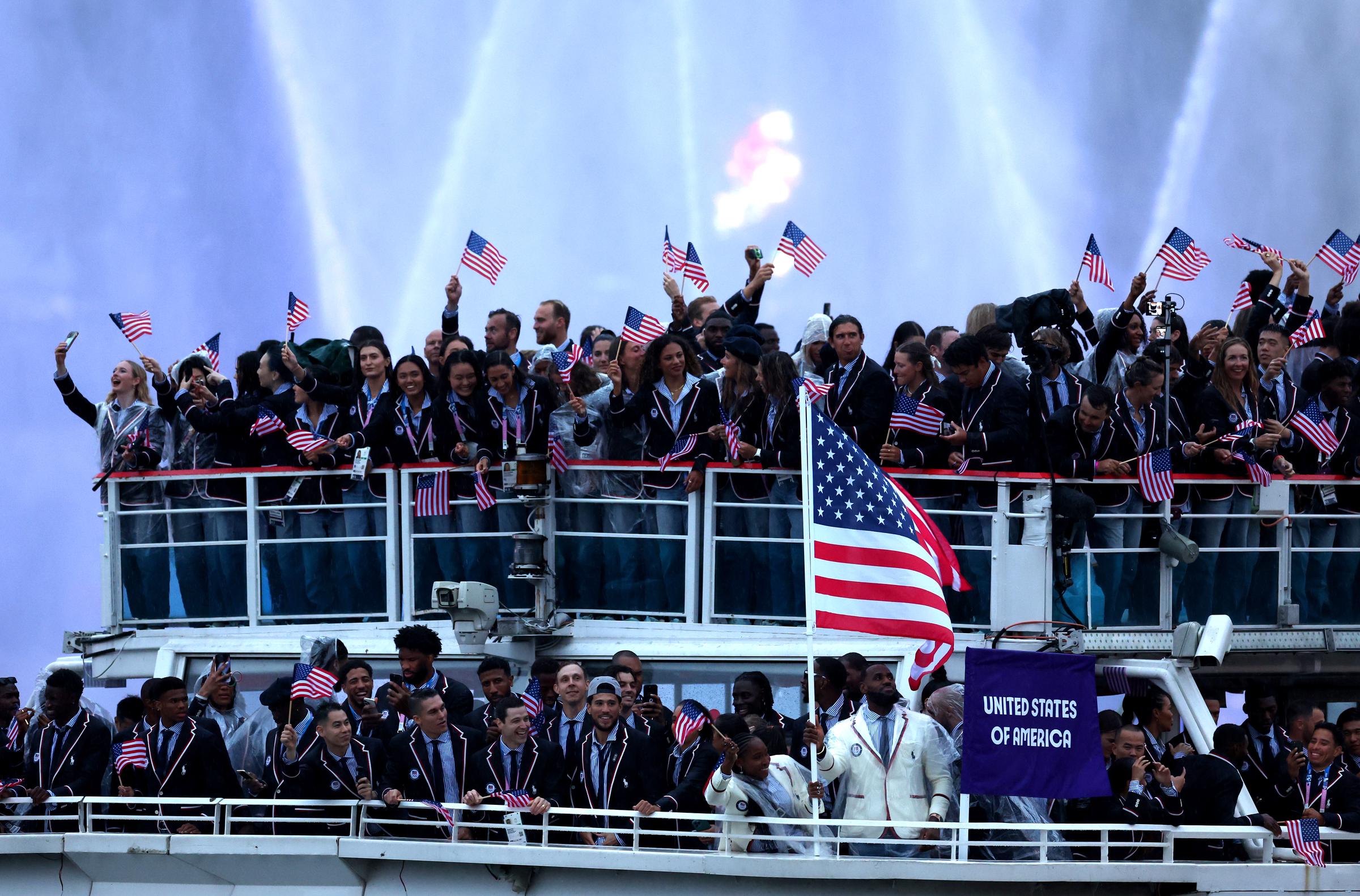 Lebron James waves the American flag while cruising on the River Seine during the athletes’ parade during the opening ceremony of the Olympic Games Paris 2024 in Paris, France, on July 26, 2024. | Source: Getty Images