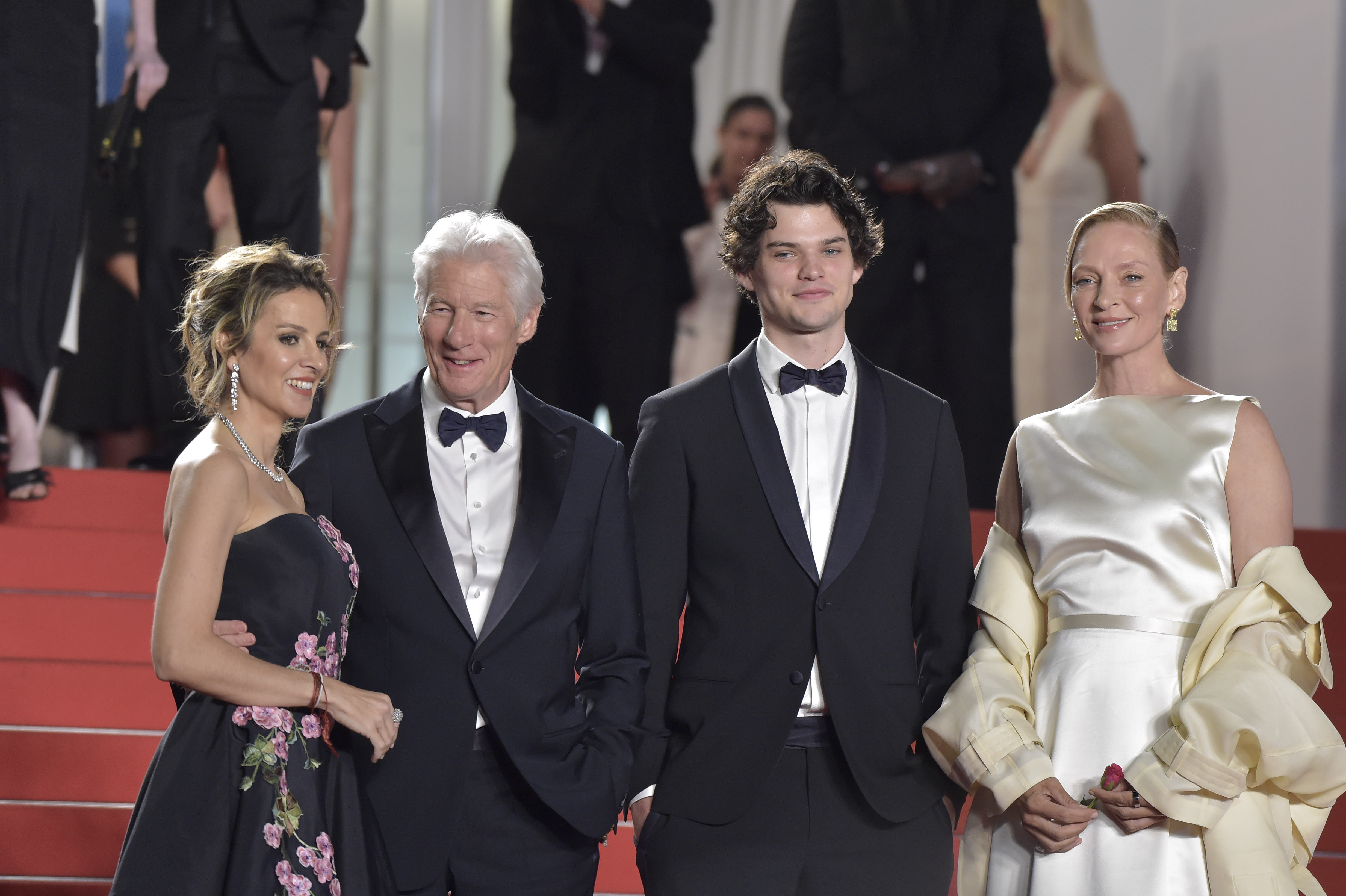 Richard Gere, his wife Alejandra Silva, his son Homer James Jigme Gere and Uma Thurman at Cannes Film Festival 2024 | Source: Getty Images