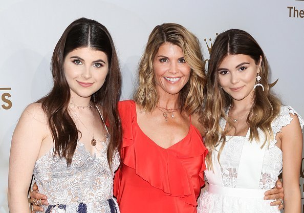 Lori Loughlin and her daughters Isabella Rose and Olivia Jade Giannulli attend the Hallmark Channel And Hallmark Movies And Mysteries 2017 Summer TCA Tour at on July 27, 2017 in Beverly Hills, California. | Photo: Getty Images