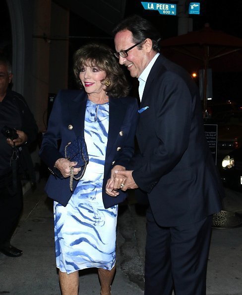 Joan Collins and Percy Gibson are seen on November 14, 2019 in Los Angeles, California | Photo: Getty Images