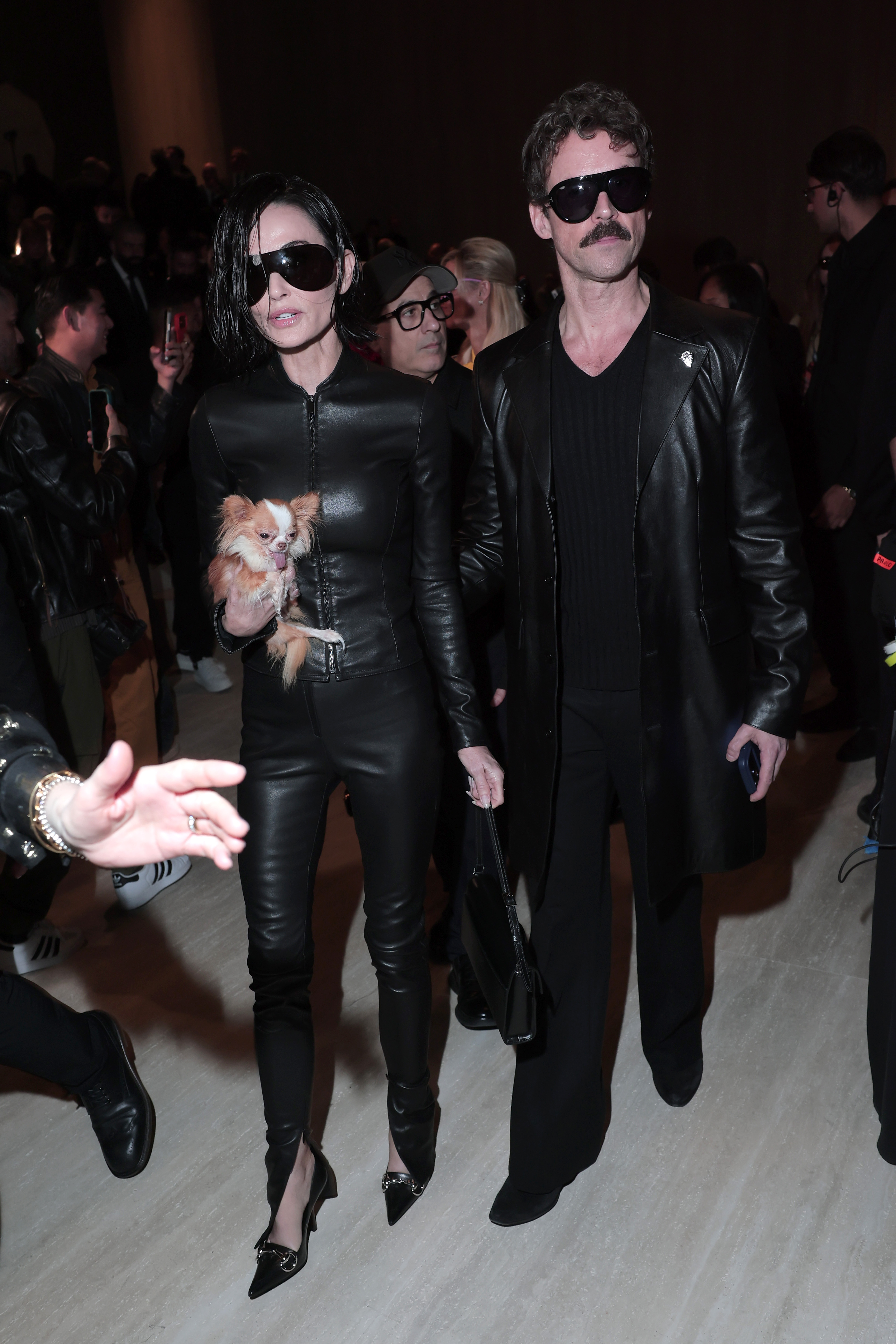 Demi Moore and Brad Goreski attend the Gucci FW26 Fashion Show at Palazzo Delle Scintille in Milan, Italy on February 27, 2026. | Source: Getty Images