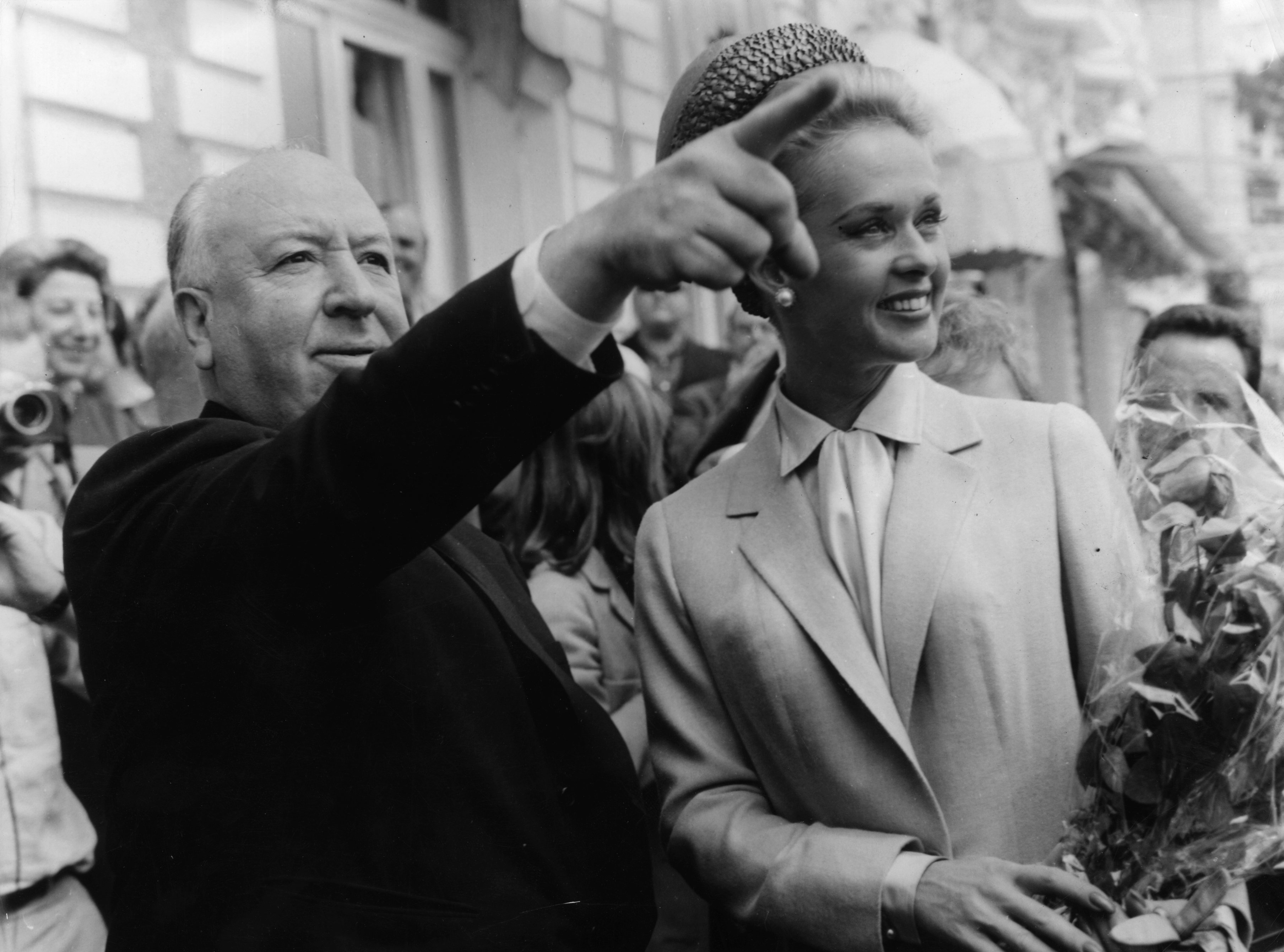 Alfred Hitchcock and American actress Tippi Hedren explore Cannes together after the premiere of his latest thriller 'The Birds' in which she plays the title role. | Source: Getty Images