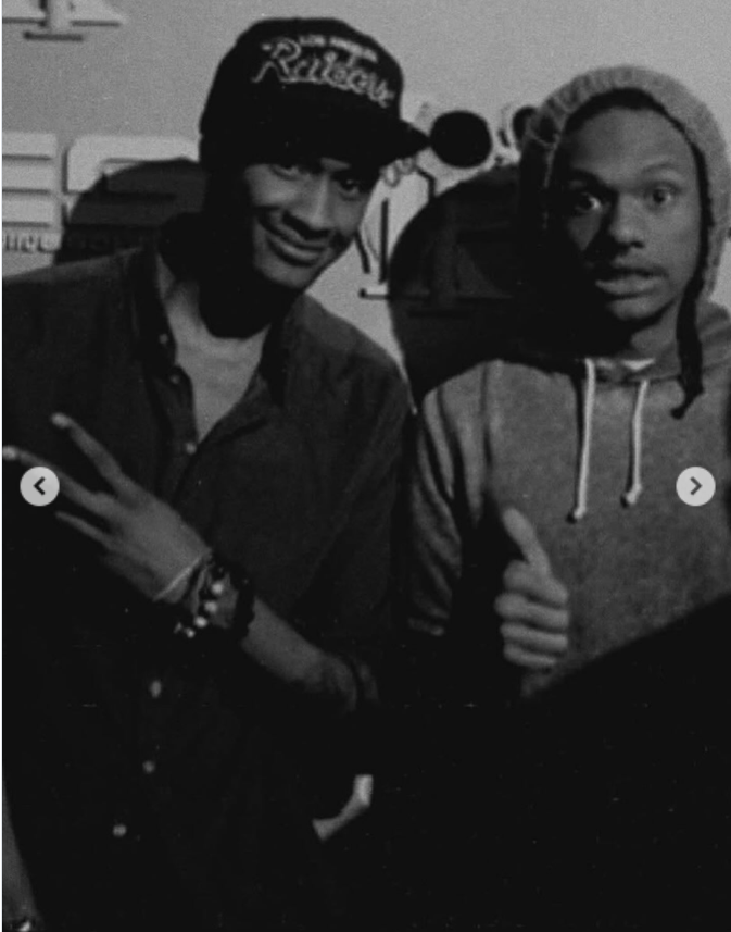 A black-and-white photo of  Niko and Brian McKnight Jr., standing side by side,  from a post dated September 28, 2025. | Source: Instagram/itsjuliemcknight