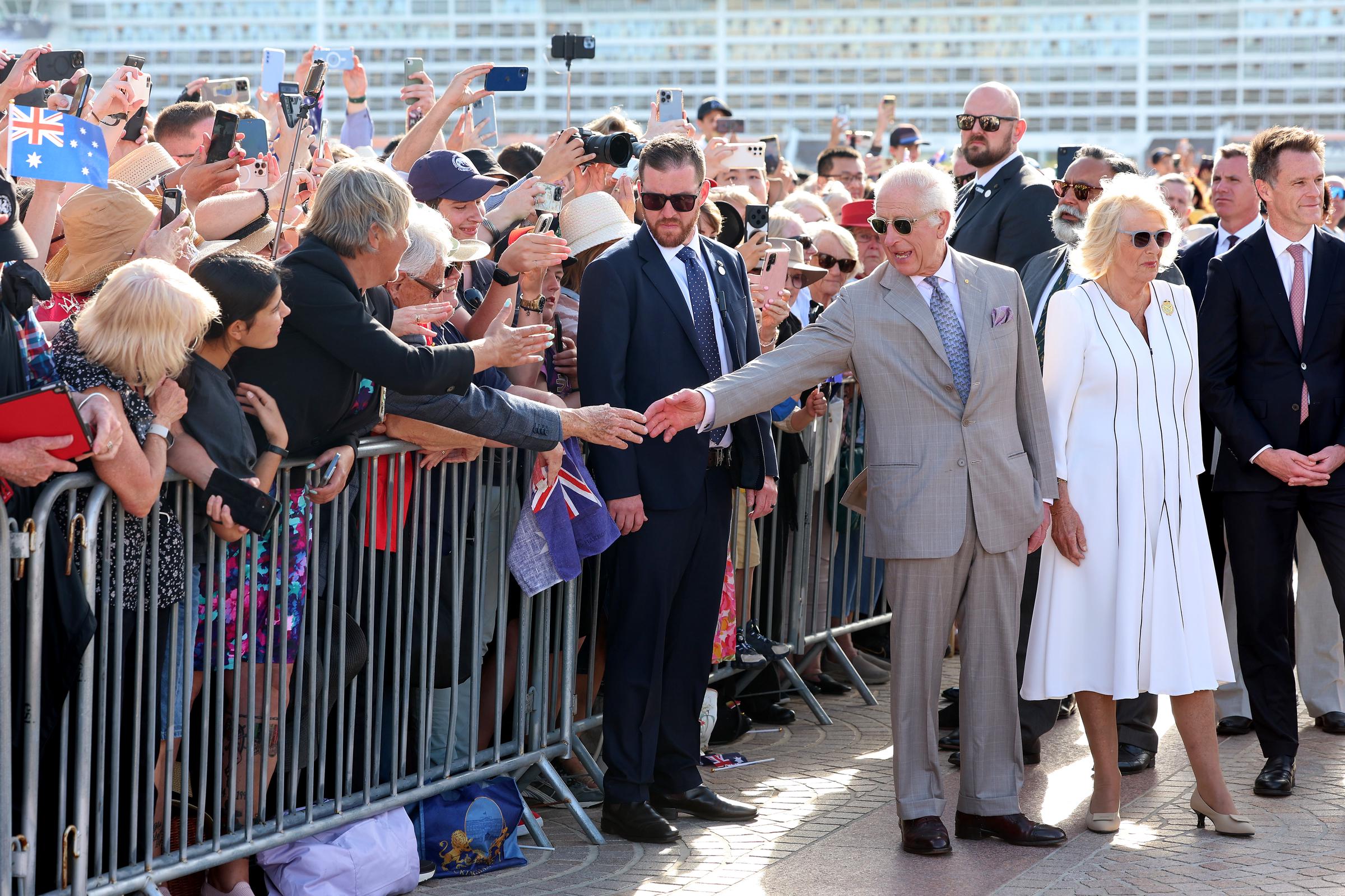 King Charles III greets a spectator as he arrives at the Sydney Opera House on October 22, 2024, in Sydney, Australia. | Source: Getty Images