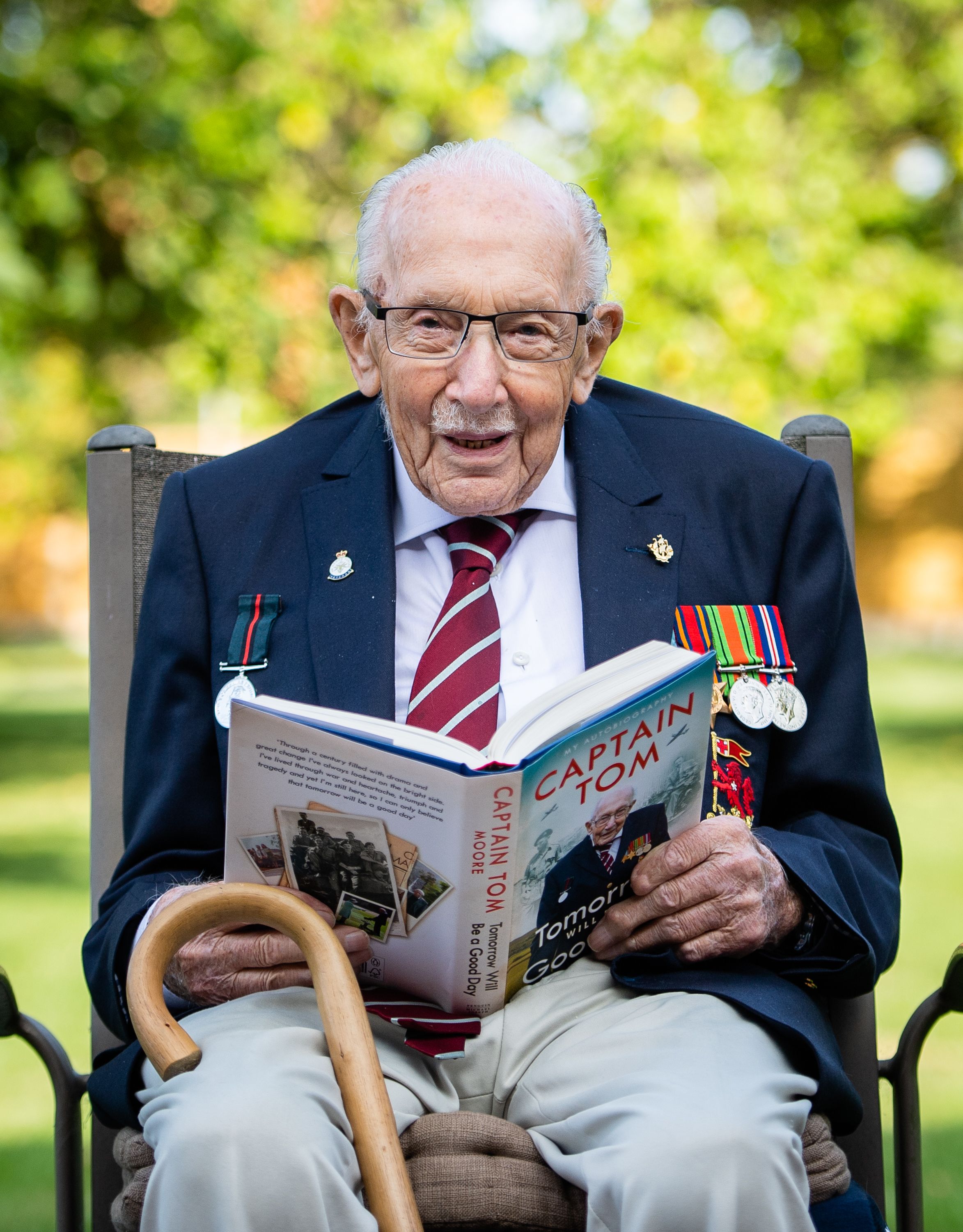 Captain Sir Tom Moore poses during a photocall to mark the launch of his memoir "Tomorrow Will Be A Good Day" on September 17, 2020, in Milton Keynes, England | Photo: Samir Hussein/WireImage/Getty Images