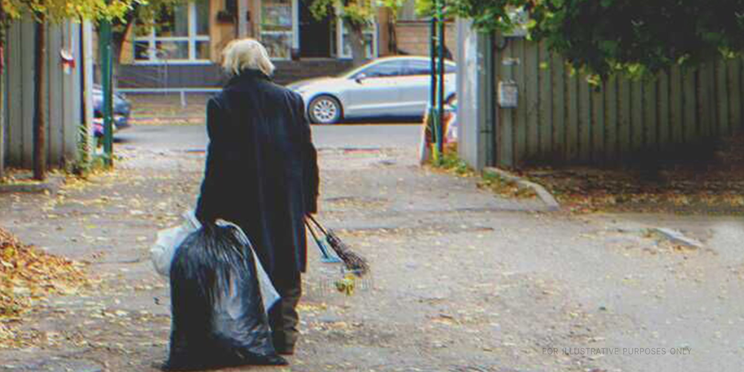 Older woman disposing of garbage | Source: Shutterstock