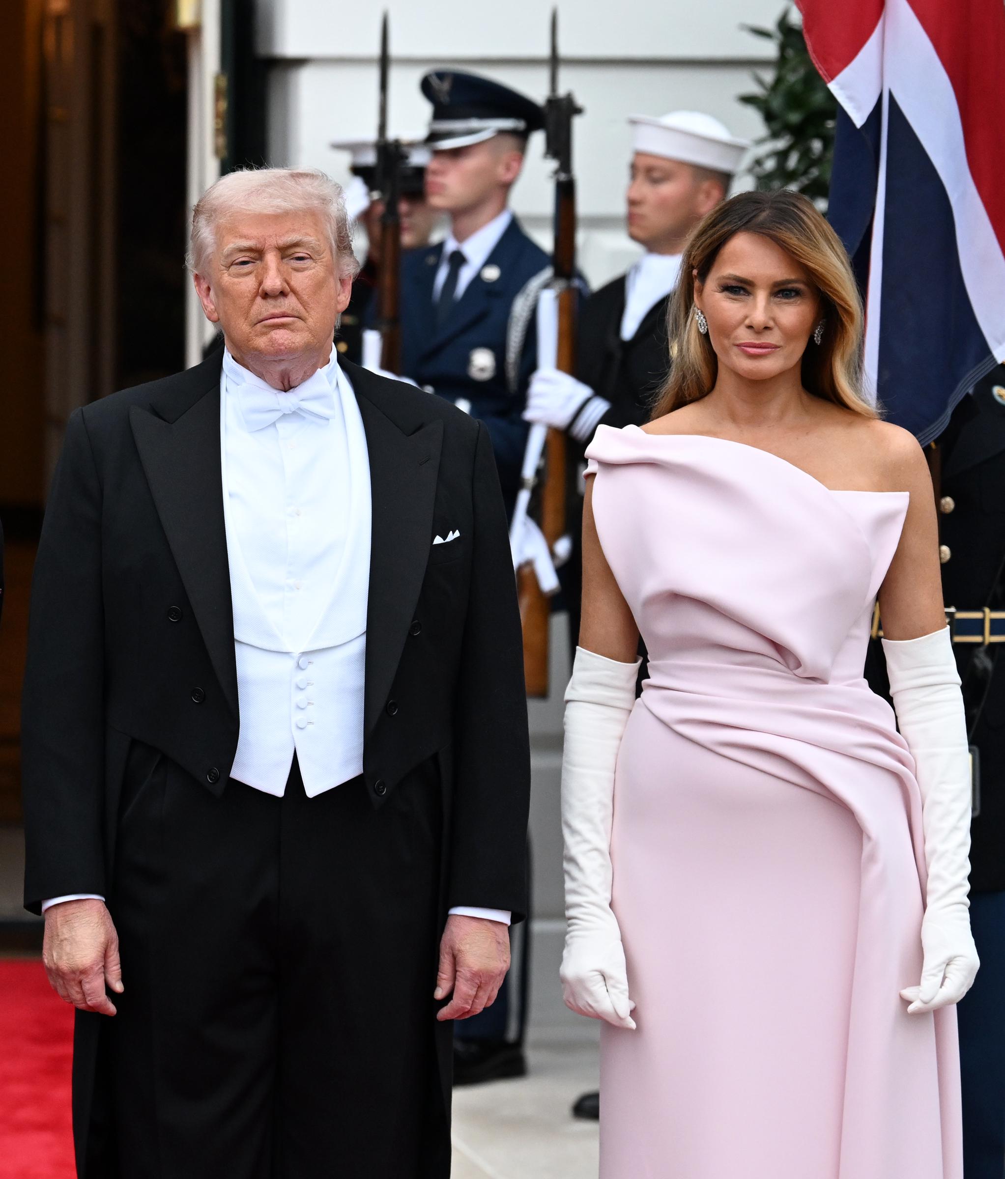 Donald and Melania Trump pose outside during an official state dinner hosted at The White House on day two of the State Visit of King Charles III and Queen Camilla to the US, on April 28, 2026 in Washington, DC | Source: Getty Images