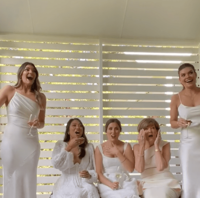 Camille Lescai's bridal party reacts to her wedding dress reveal. | Source: Tiktok.com/@camillelescai