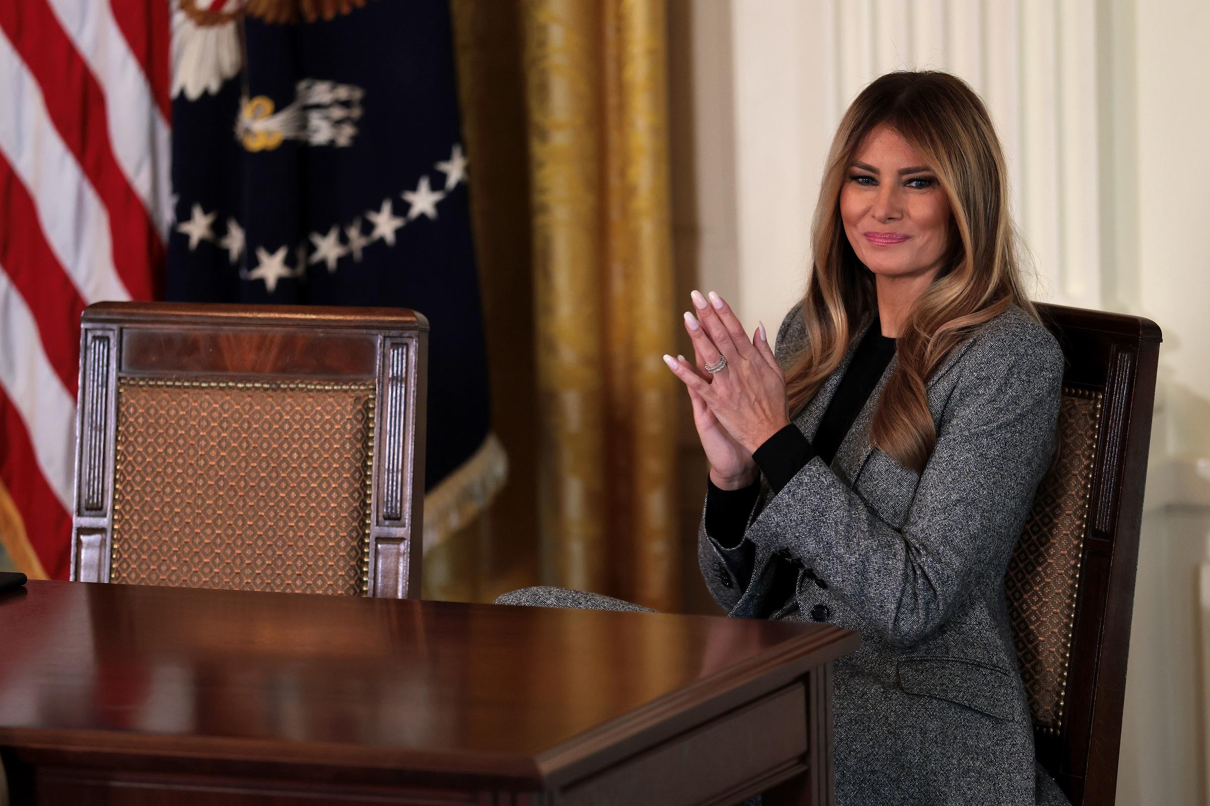 Melania Trump claps during the signing ceremony for the "Fostering the Future" executive order in the East Room of the White House on November 13, 2025 | Source: Getty Images