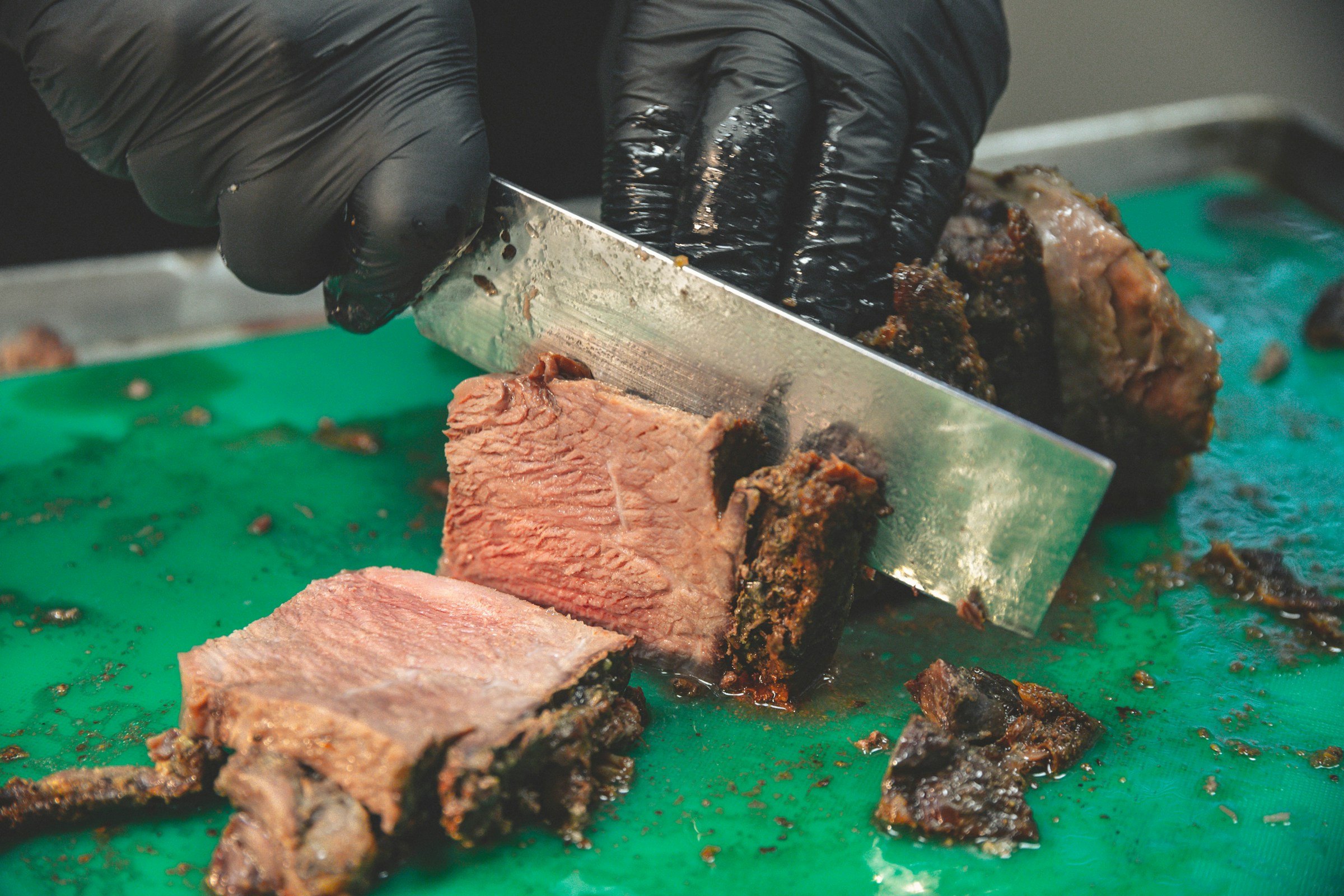 A person cutting a steak | Source: Unsplash