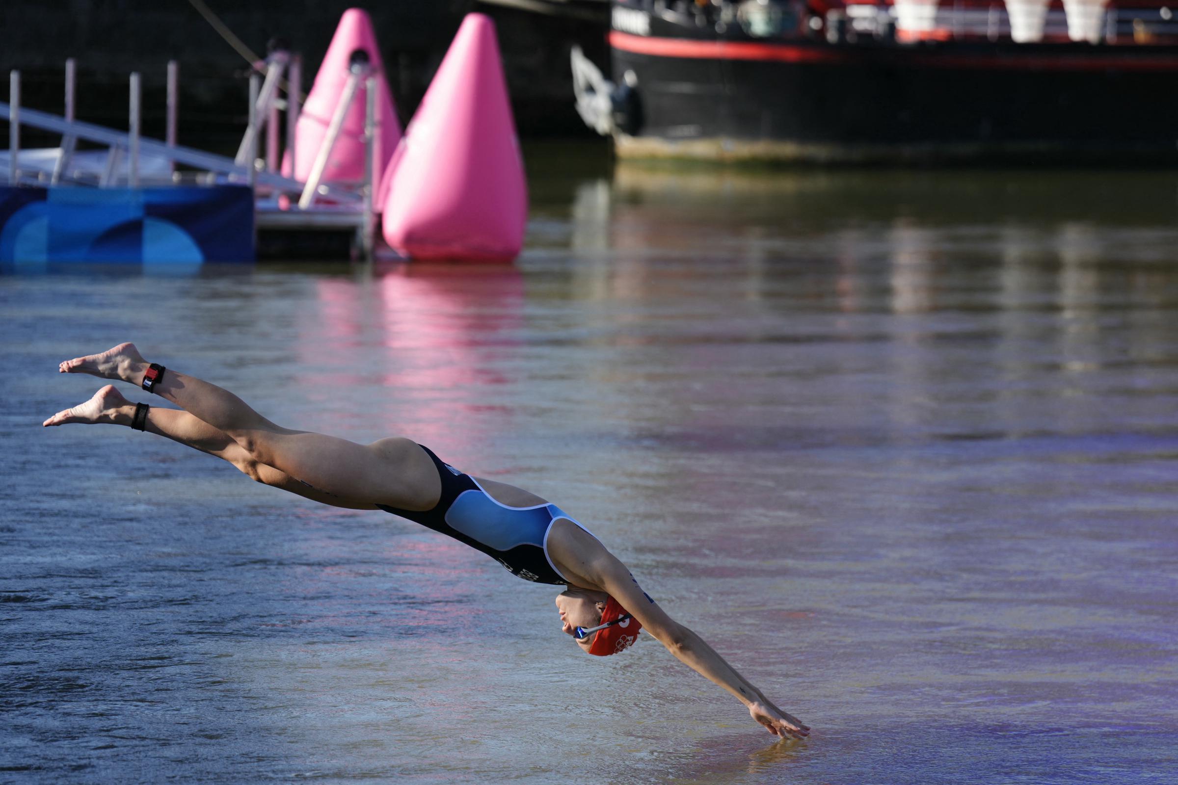 Cassandre Beaugrand dives into the Seine for the swimming portion of the mixed relay triathlon at the Paris 2024 Olympics on August 5, 2024 | Source: Getty Images