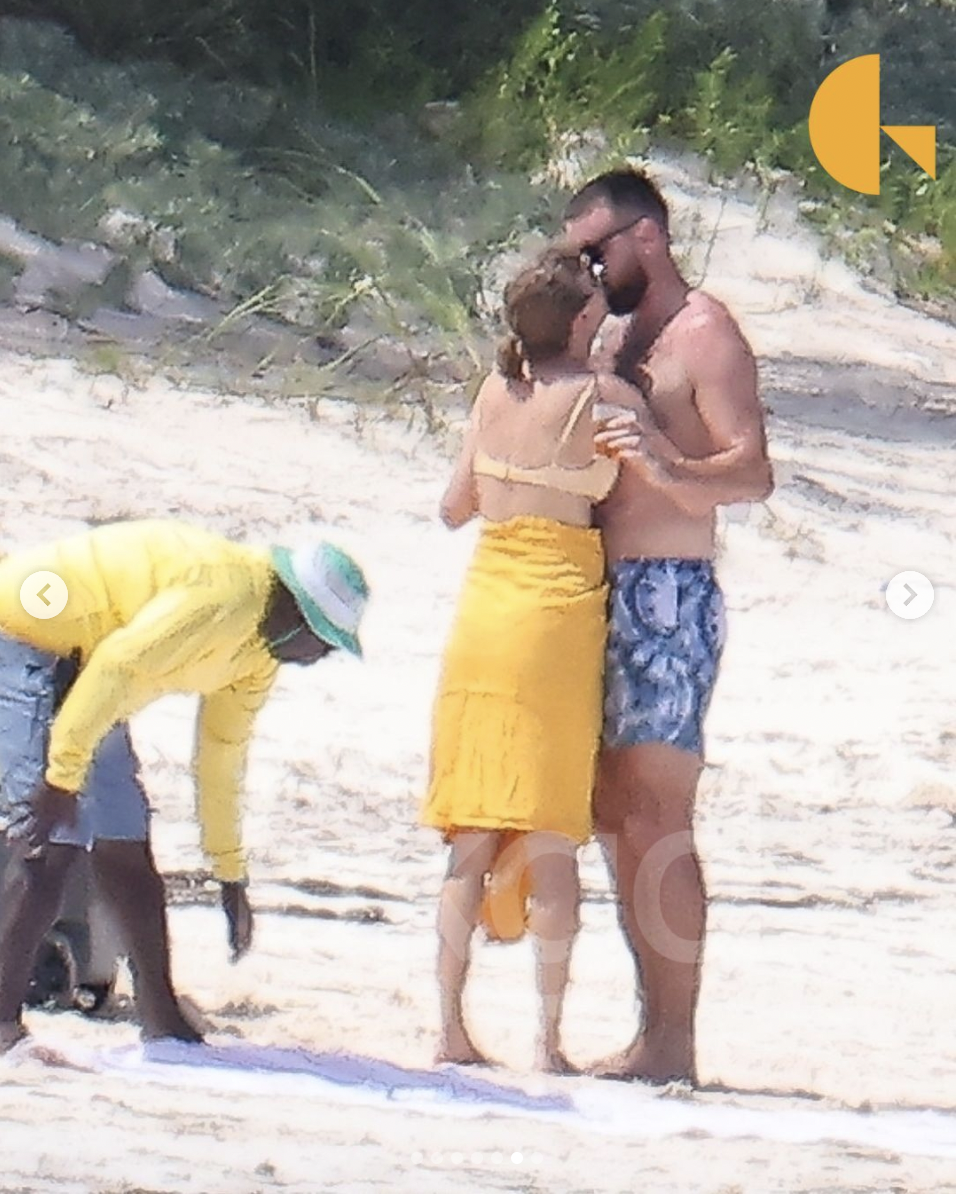 Taylor Swift and Travis Kelce sharing a kiss during their beach getaway in the Bahamas on March 21, 2024 | Source: Instagram/backgrid_usa