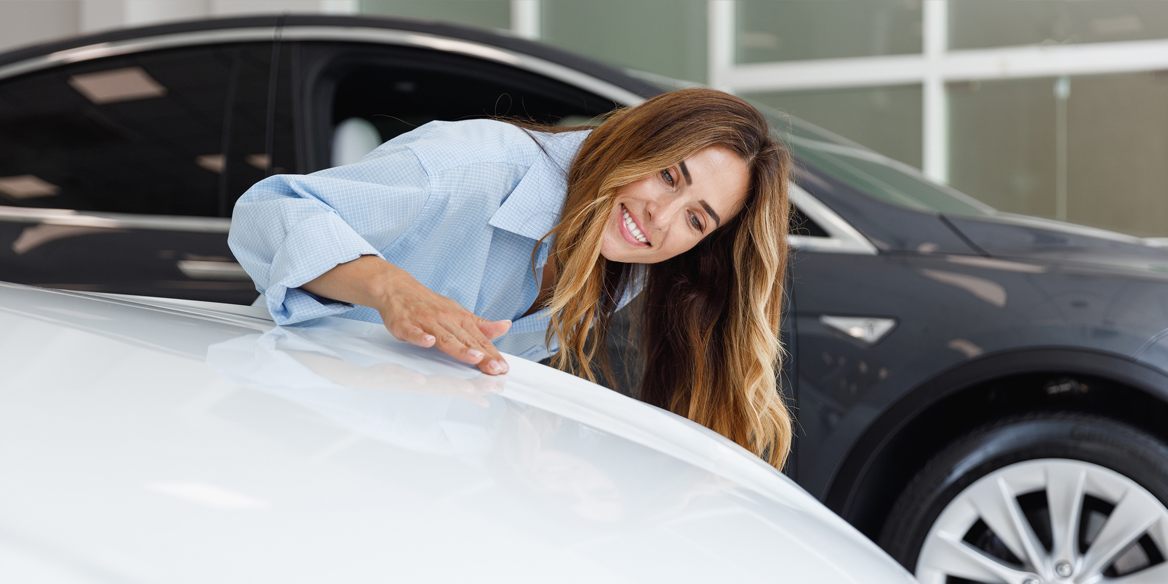 Woman admiring a car | Source: Shutterstock