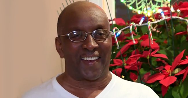 Frankie Allison with a poinsettia plant behind him.┃Source: facebook.com/cbcnews