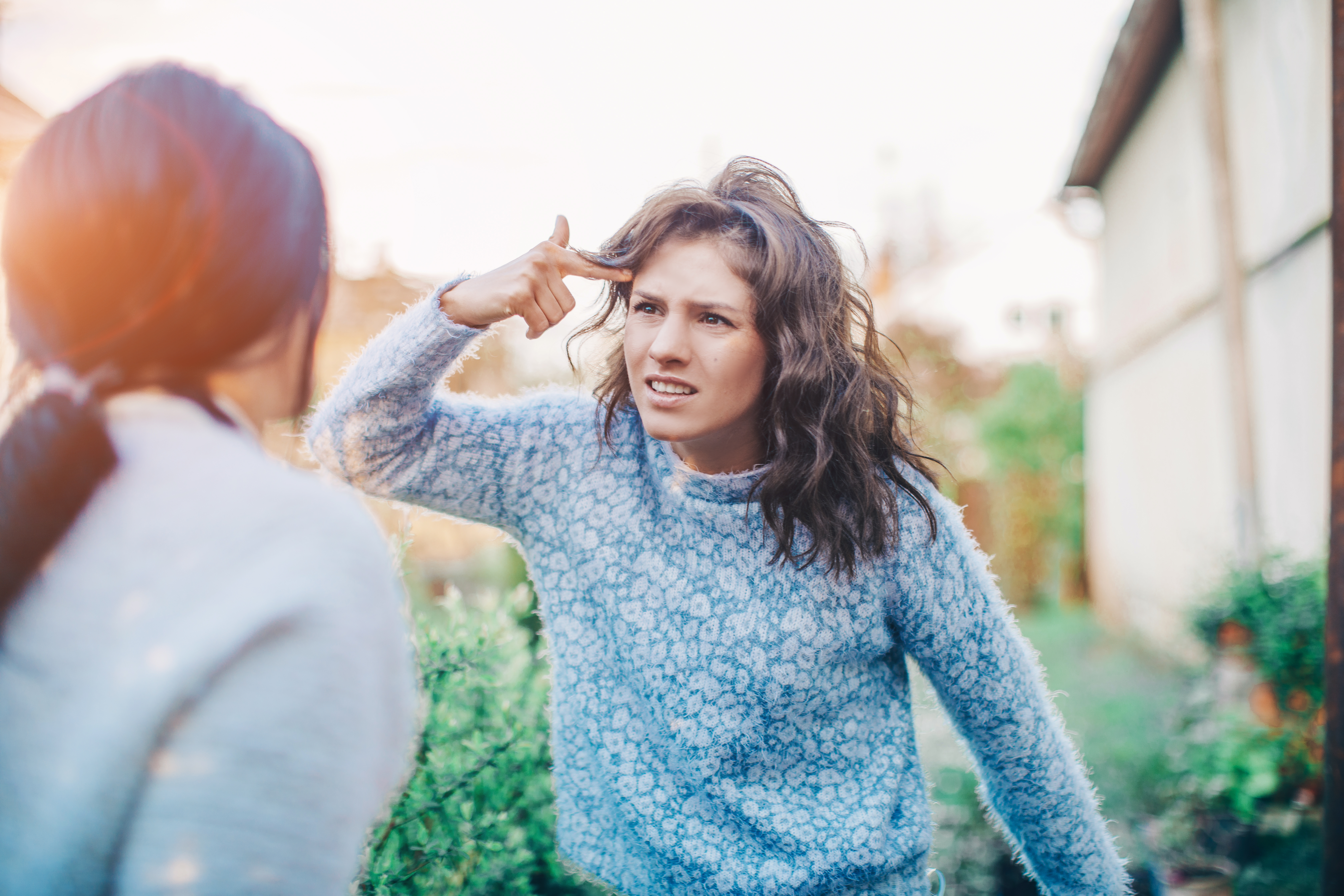 Two women arguing with each other | Source: Shutterstock