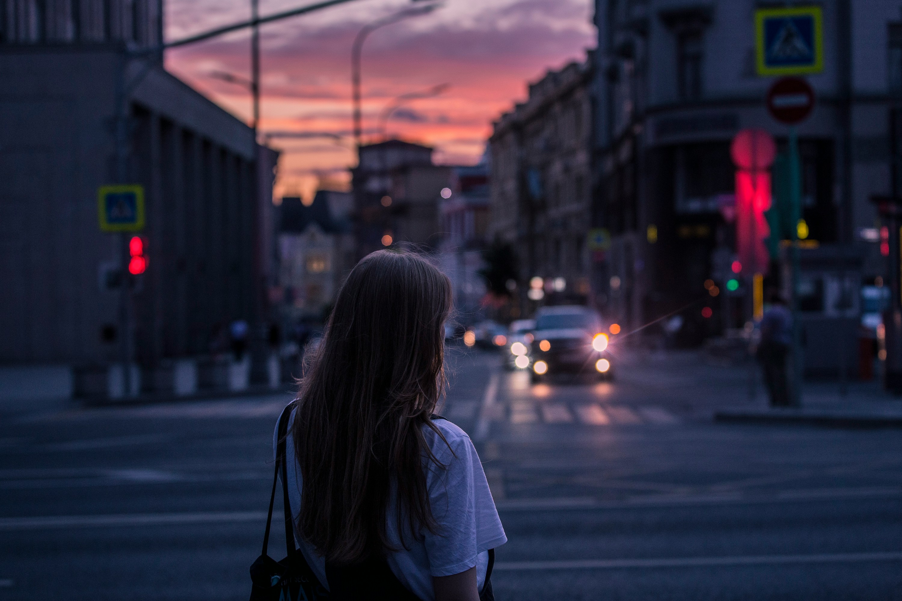 A woman on the street at night | Source: Unsplash
