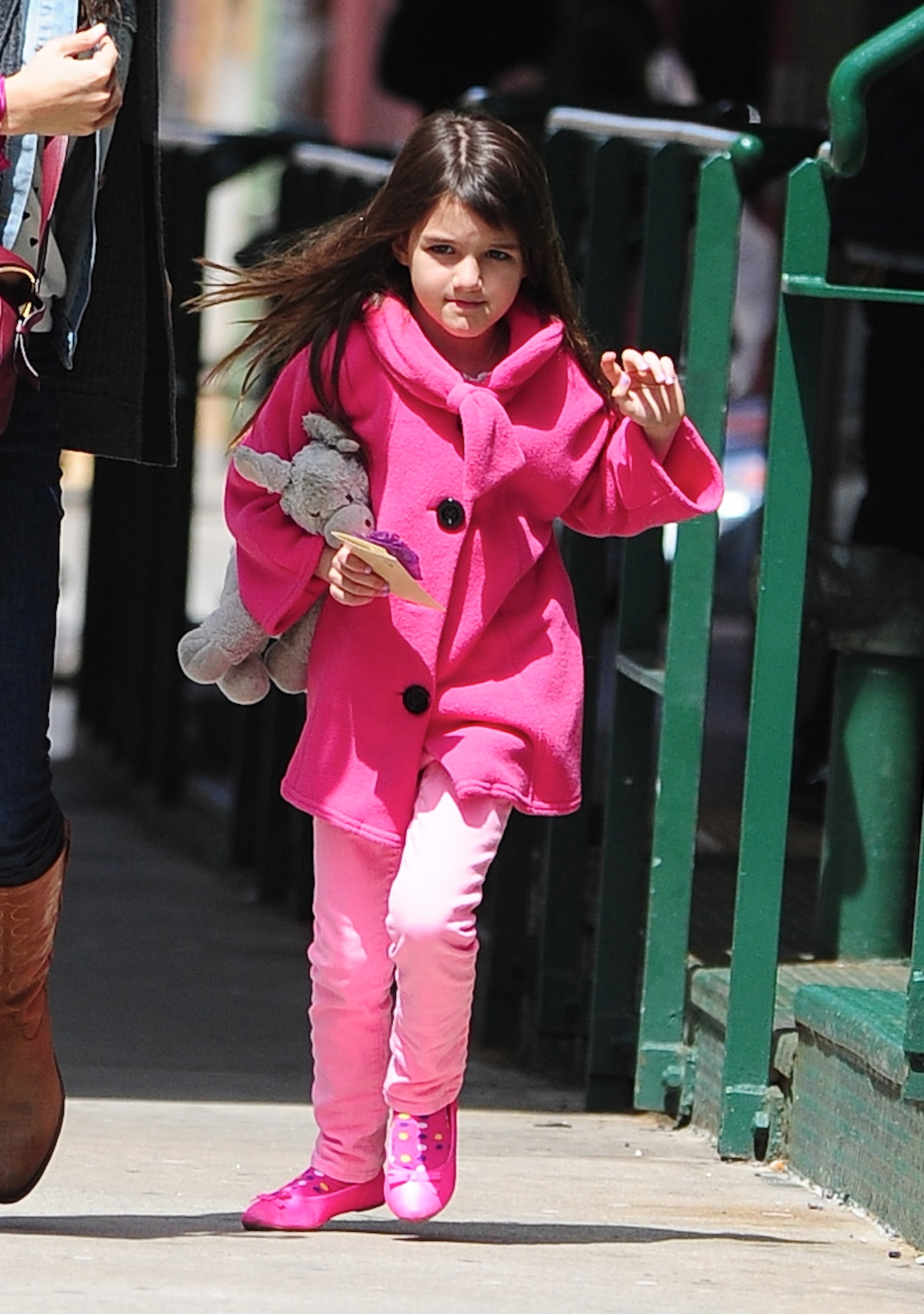 Suri Cruise is photographed walking through Tribeca while carrying a stuffed toy during an outing in New York City. | Source: Getty Images