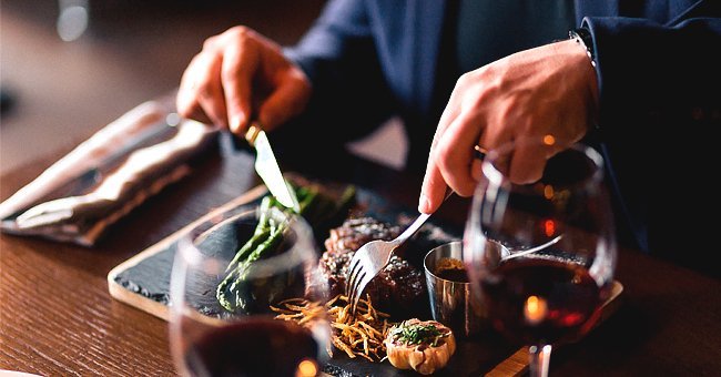 A man eating noodles at a restaurant | Photo: Shutterstock.com