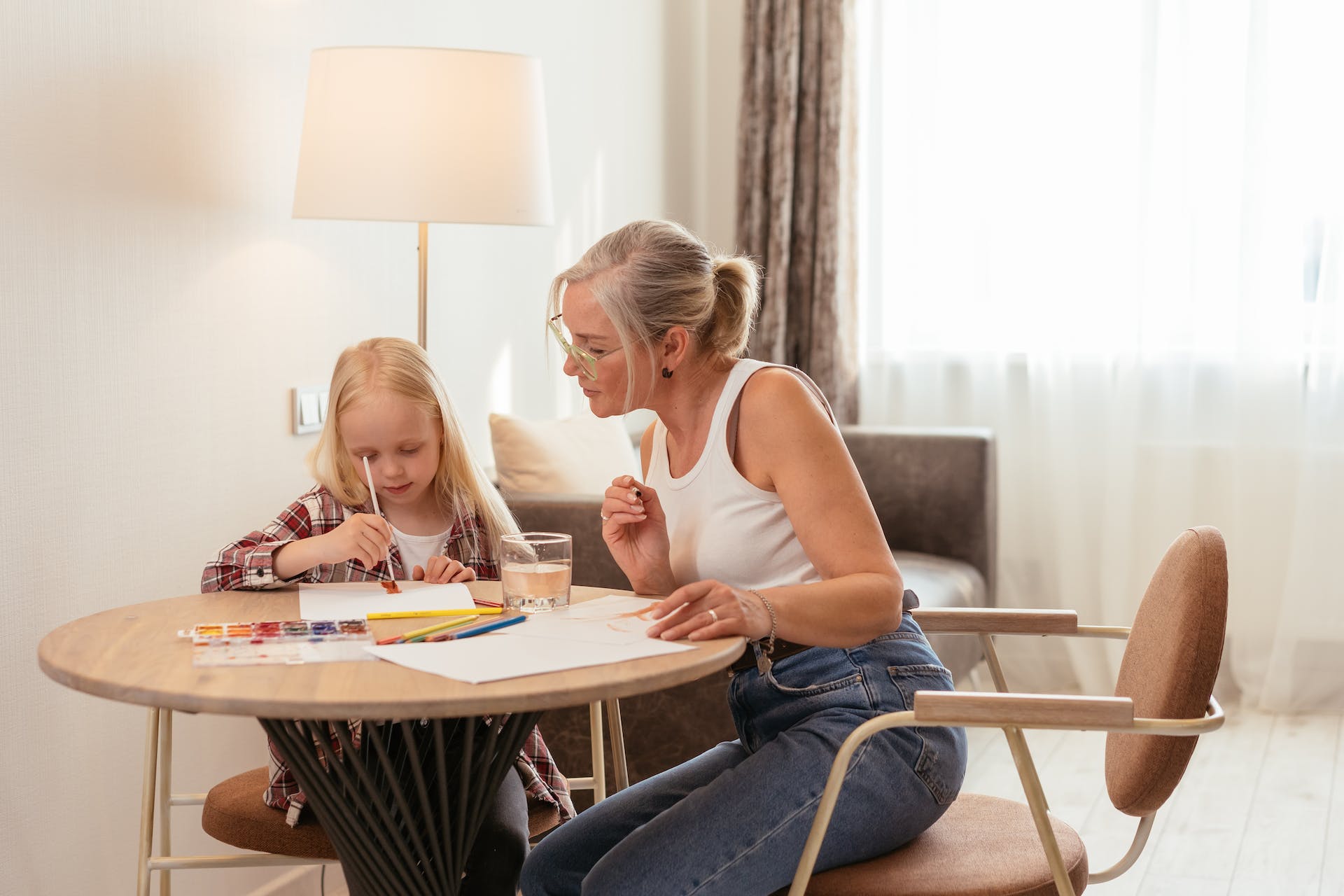 A young girl doing painting with her grandma | Source: Pexels