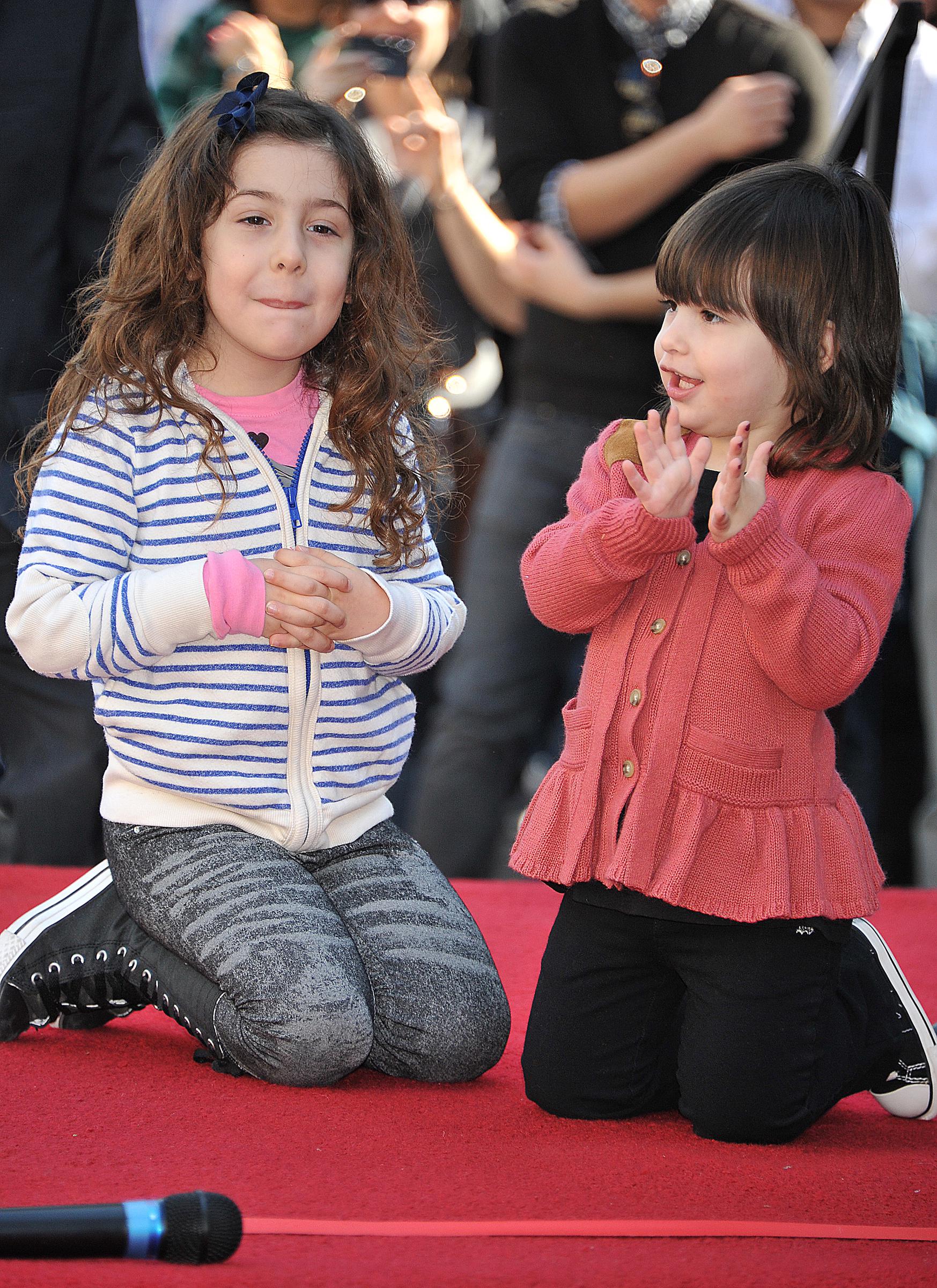 Sunny and Sadie Sandler at the ceremony honoring Adam Sandler with a Star on The Hollywood Walk of Fame on February 1, 2011. | Source: Getty Images