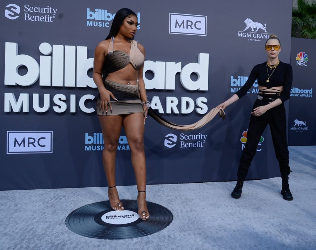 Megan Thee Stallion and Cara Delevingne during the 2022 Billboard Music Awards at MGM Grand Garden Arena on May 15, 2022 in Las Vegas, Nevada. | Source: Getty Images