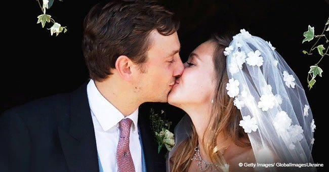 Bride dons gorgeous wedding dress, but all eyes were on her flower-covered veil