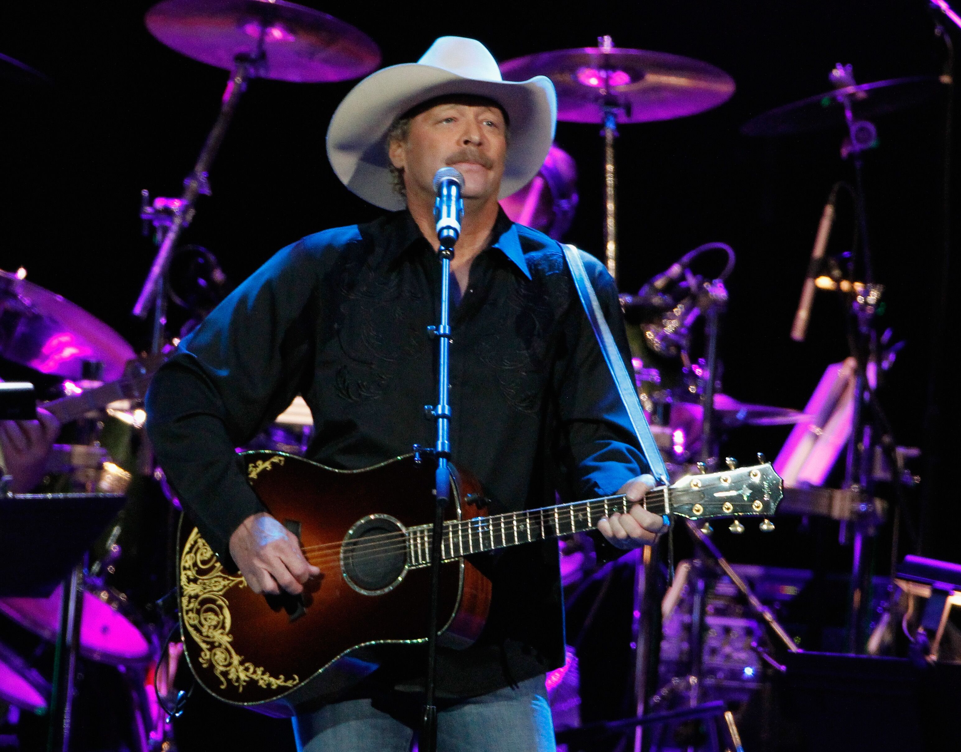 Alan Jackson performs during Playin' Possum! The Final No Show Tribute To George Jones - Show at Bridgestone Arena on November 22, 2013 in Nashville, Tennessee. | Source: Getty Images