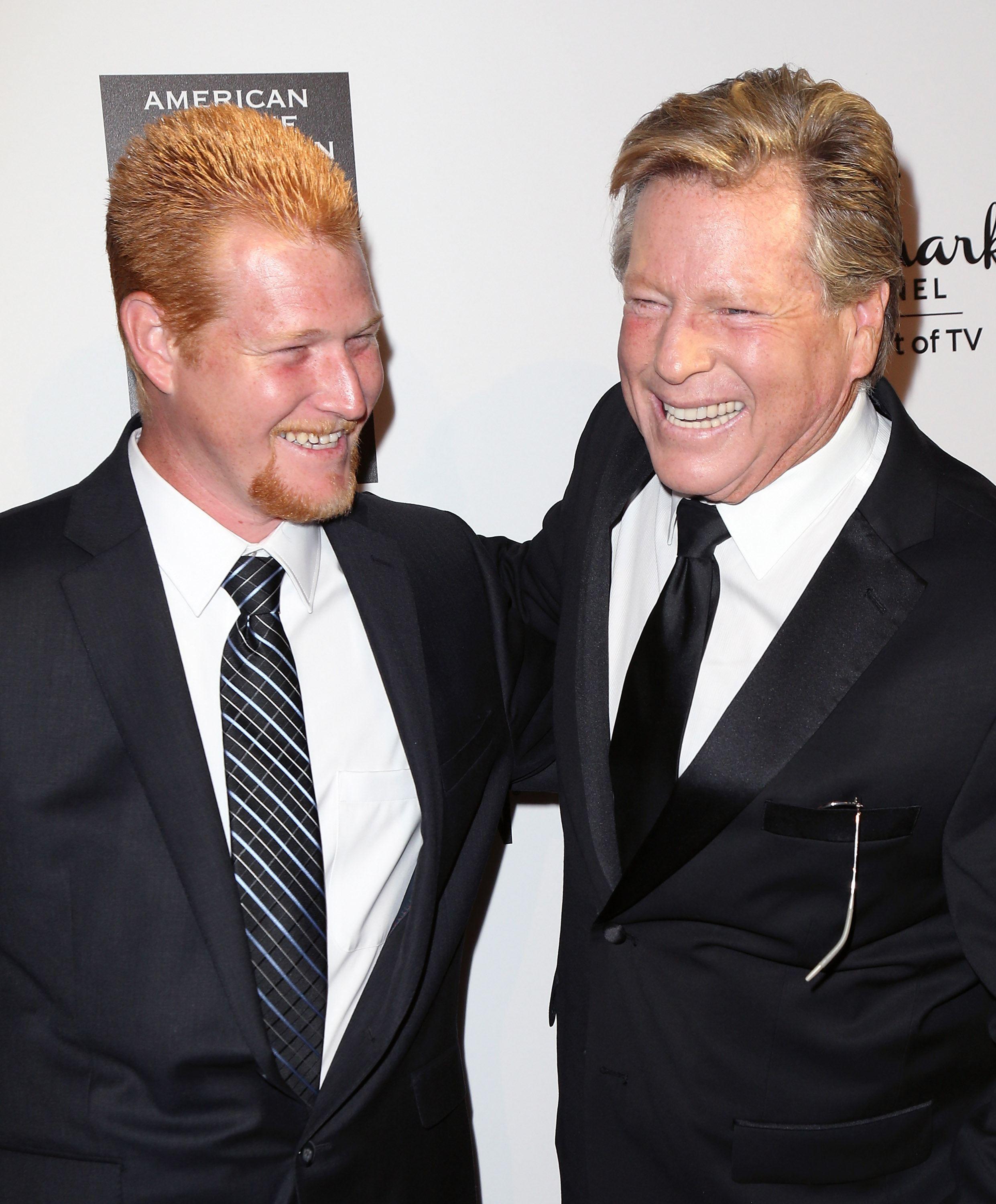 Actor Ryan O'Neal (R) and his son Redmond O'Neal at The Beverly Hilton Hotel on October 5, 2013, in Beverly Hills, California | Source: Getty Images