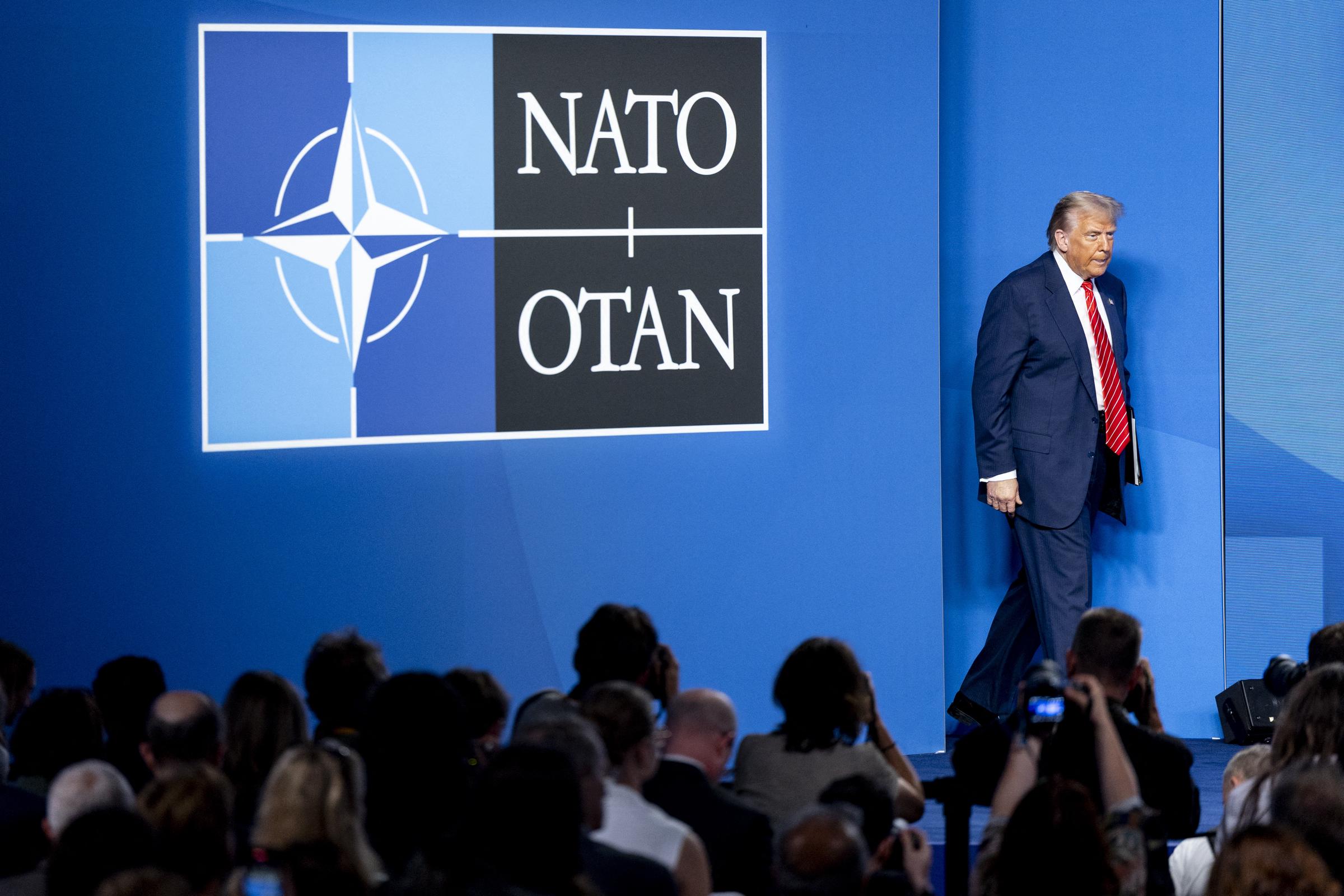 Trump steps into a room buzzing with anticipation, where journalists from around the world wait with cameras flashing and notepads ready. With a steady stride and composed demeanor, he prepares to face a barrage of tough questions.