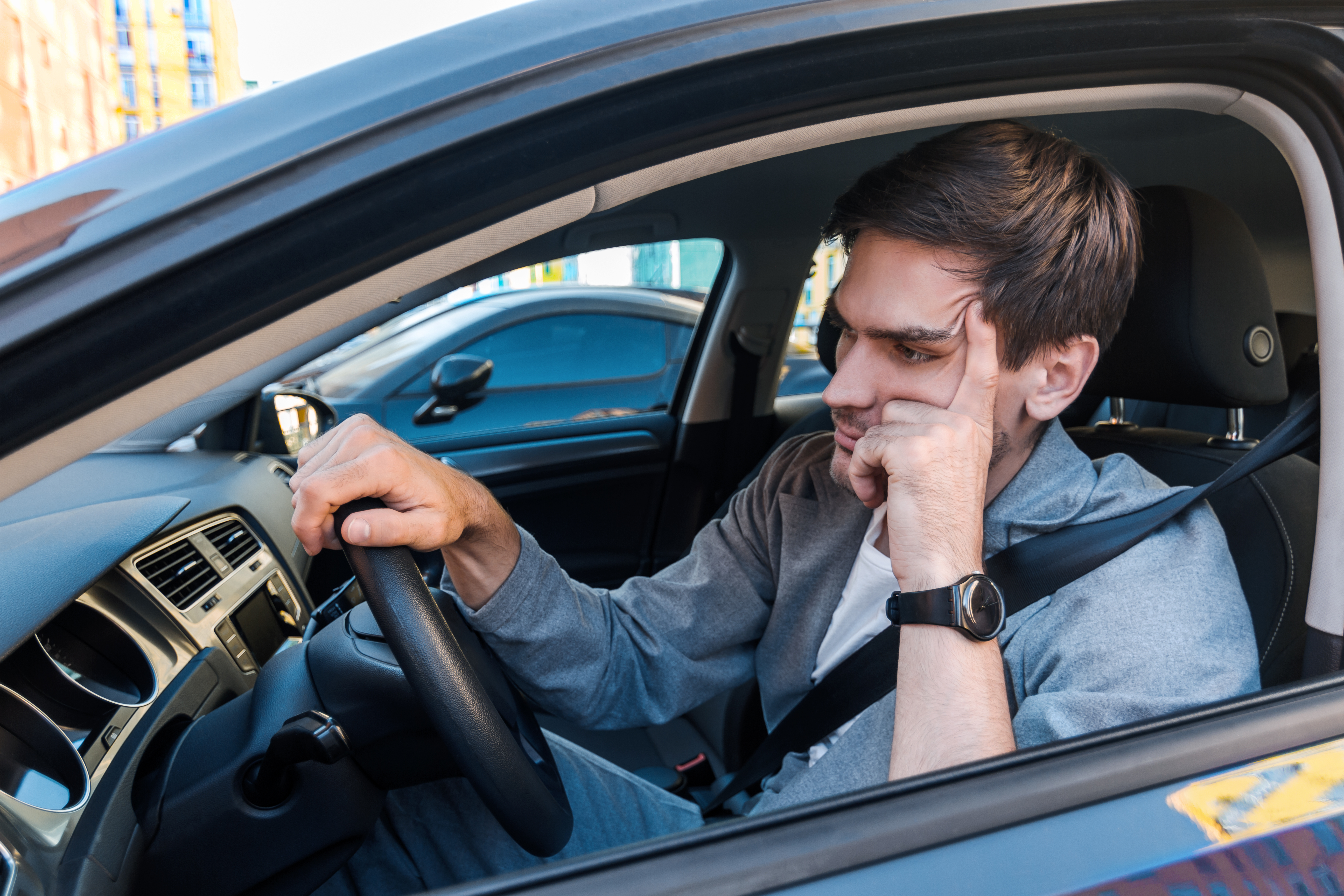 A driver stuck in traffic. | Source: Shutterstock