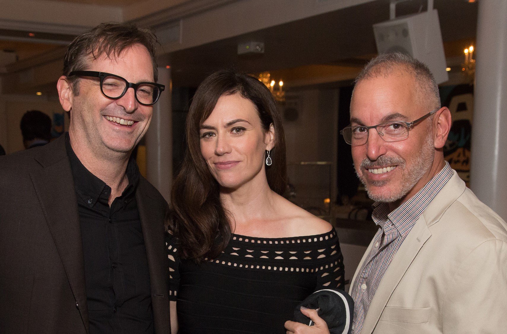 Paul Ratliff, actress Maggie Siff, and James Suskin attend Gotham Magazine Celebrates September Fall Fashion Issue at Bagatelle on September 27, 2016, in New York City. | Source: Getty Images 