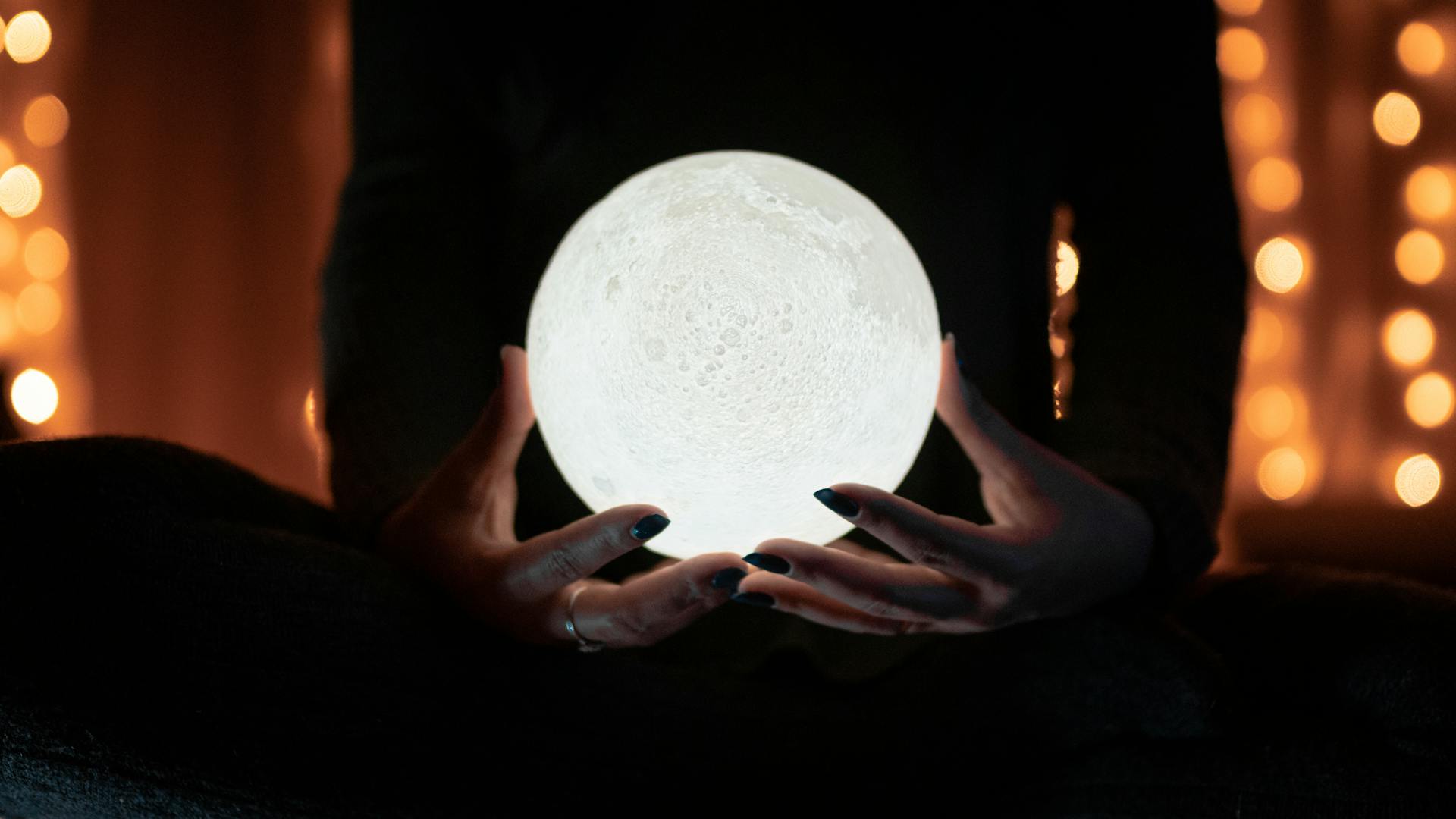 A person holding a crystal ball | Source: Pexels